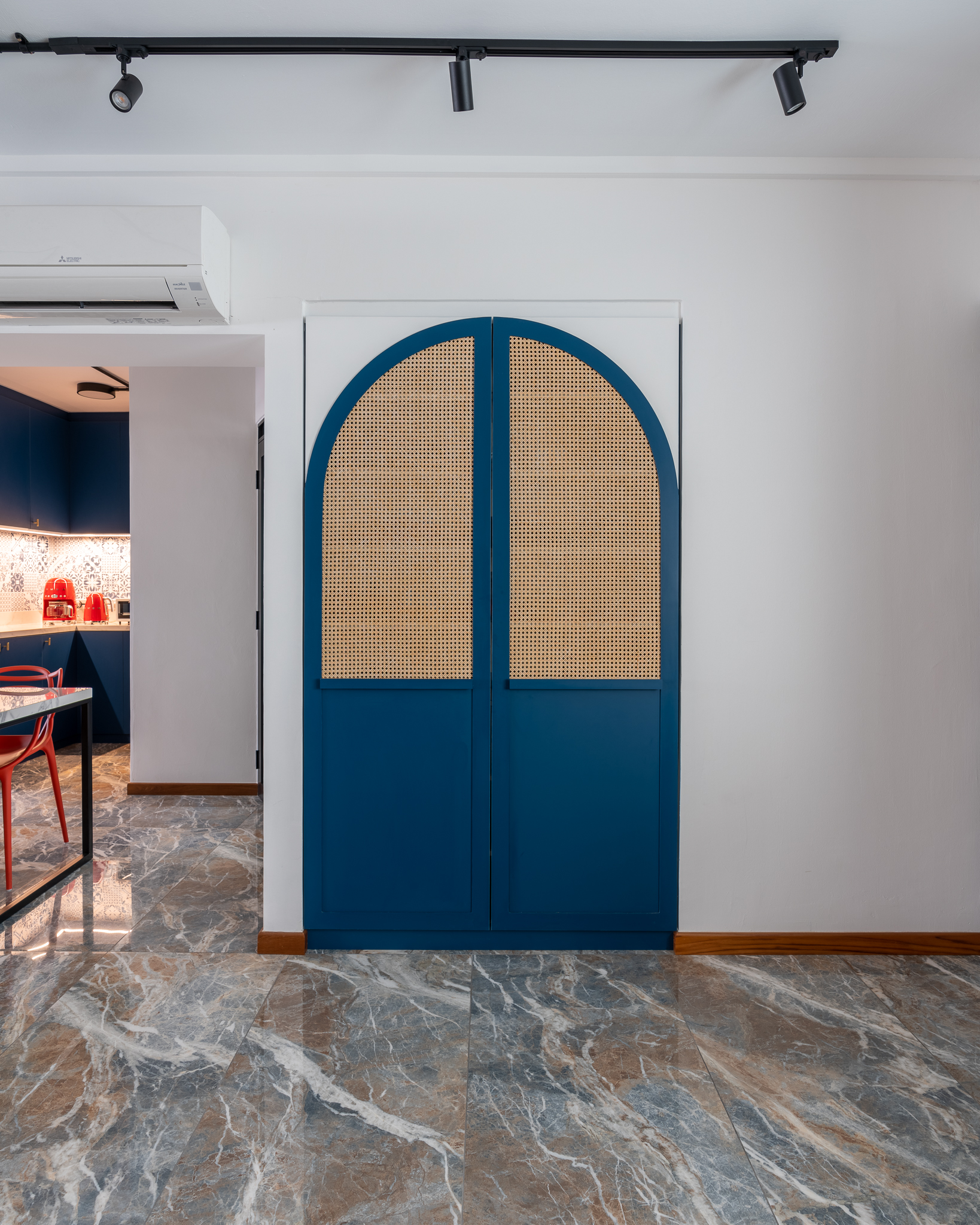 Getting Entry Out of the Way - Modern kitchen interior, blue and white color scheme, marble floor, recessed lighting, white