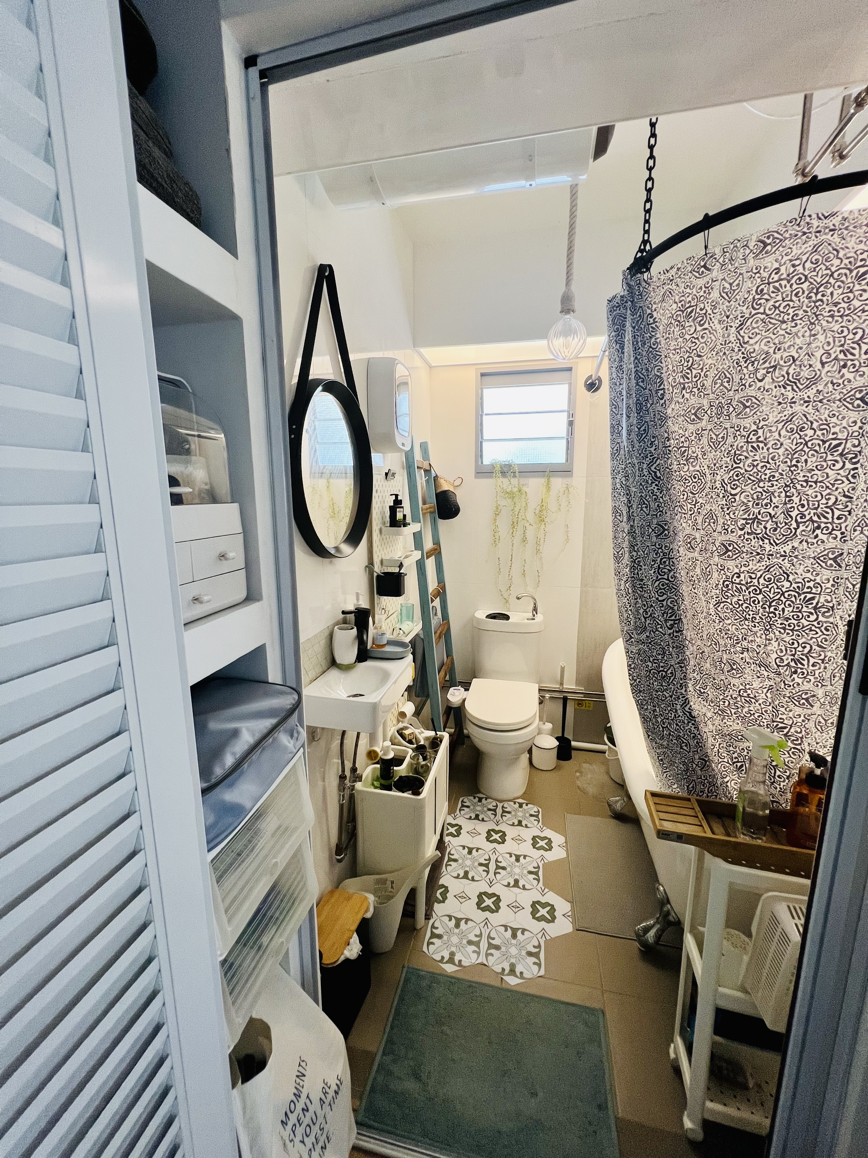 A Maximalist Haven ❤️ - Bathroom with white walls, modern design, open shelving, mirror, sink, toilet, ladder, patterned