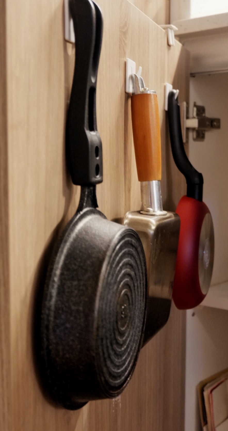 Kitchen organisation  - Wooden kitchen cabinet, knife set, black knife, red-handled knife, stainless steel knife, wooden