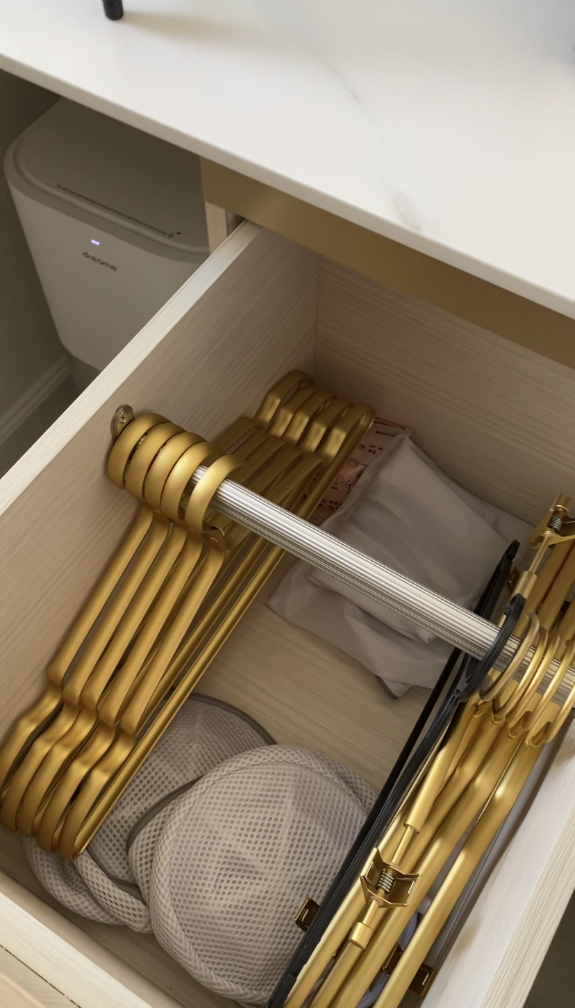 Dedicated spots in our Service Yard! - Gold drawer, neatly organized, white countertop, modern design, gold handles, white