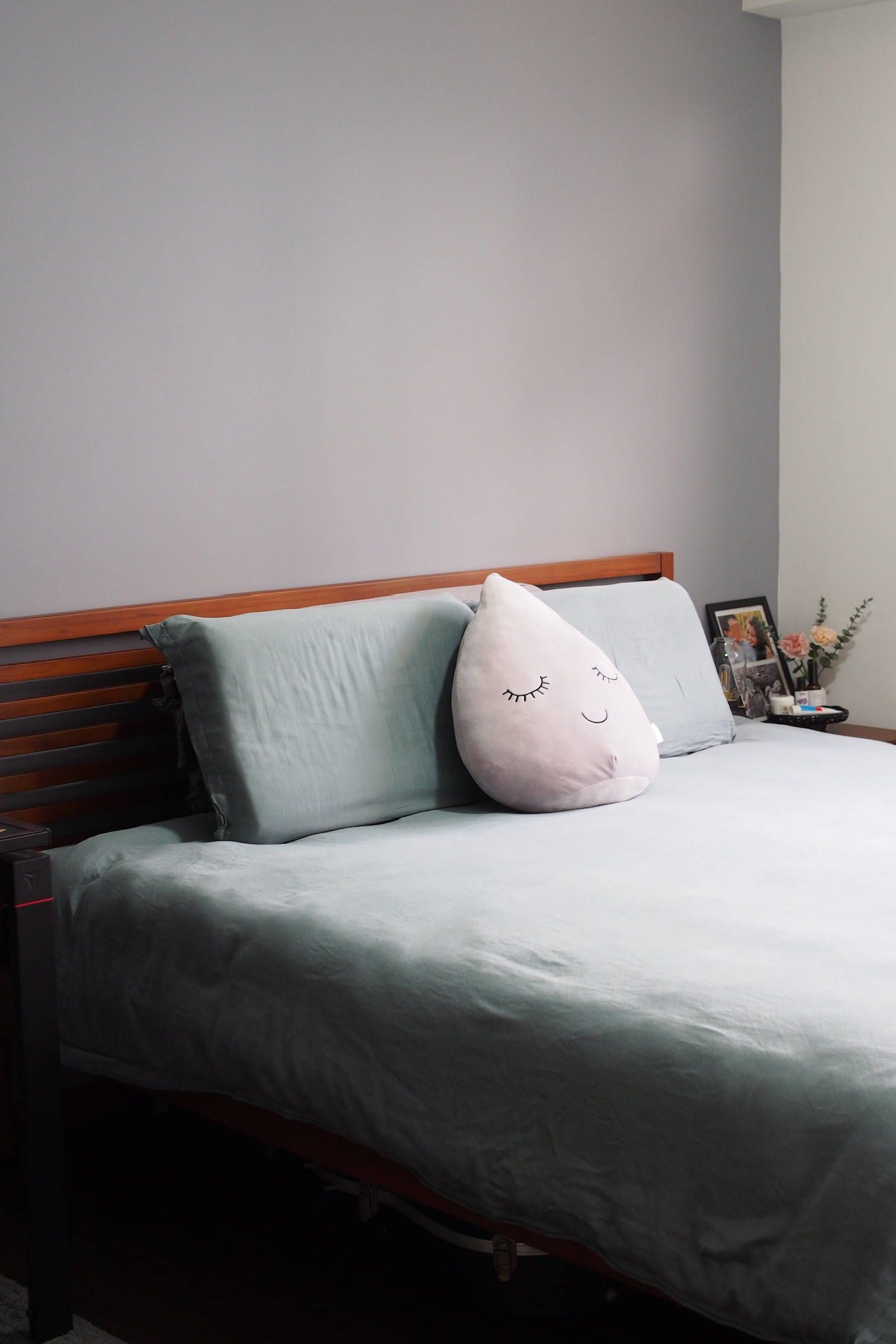 King-sized bed with ample space in the MBR? No problem! - Soft, cushioned bed with light blue bedding, wooden headboard