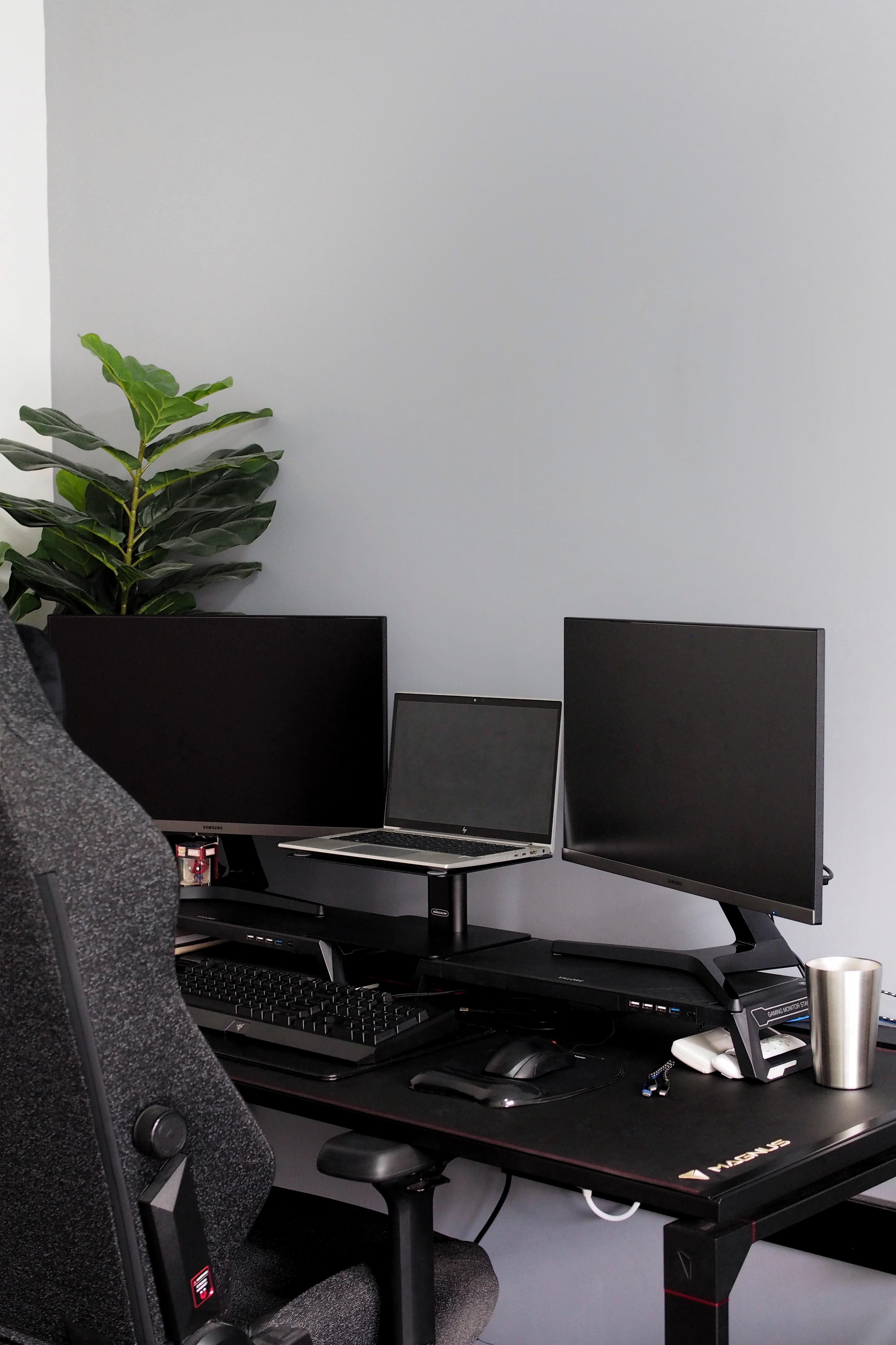 King-sized bed with ample space in the MBR? No problem! - Black ergonomic office chair, sleek black desk, dual monitors