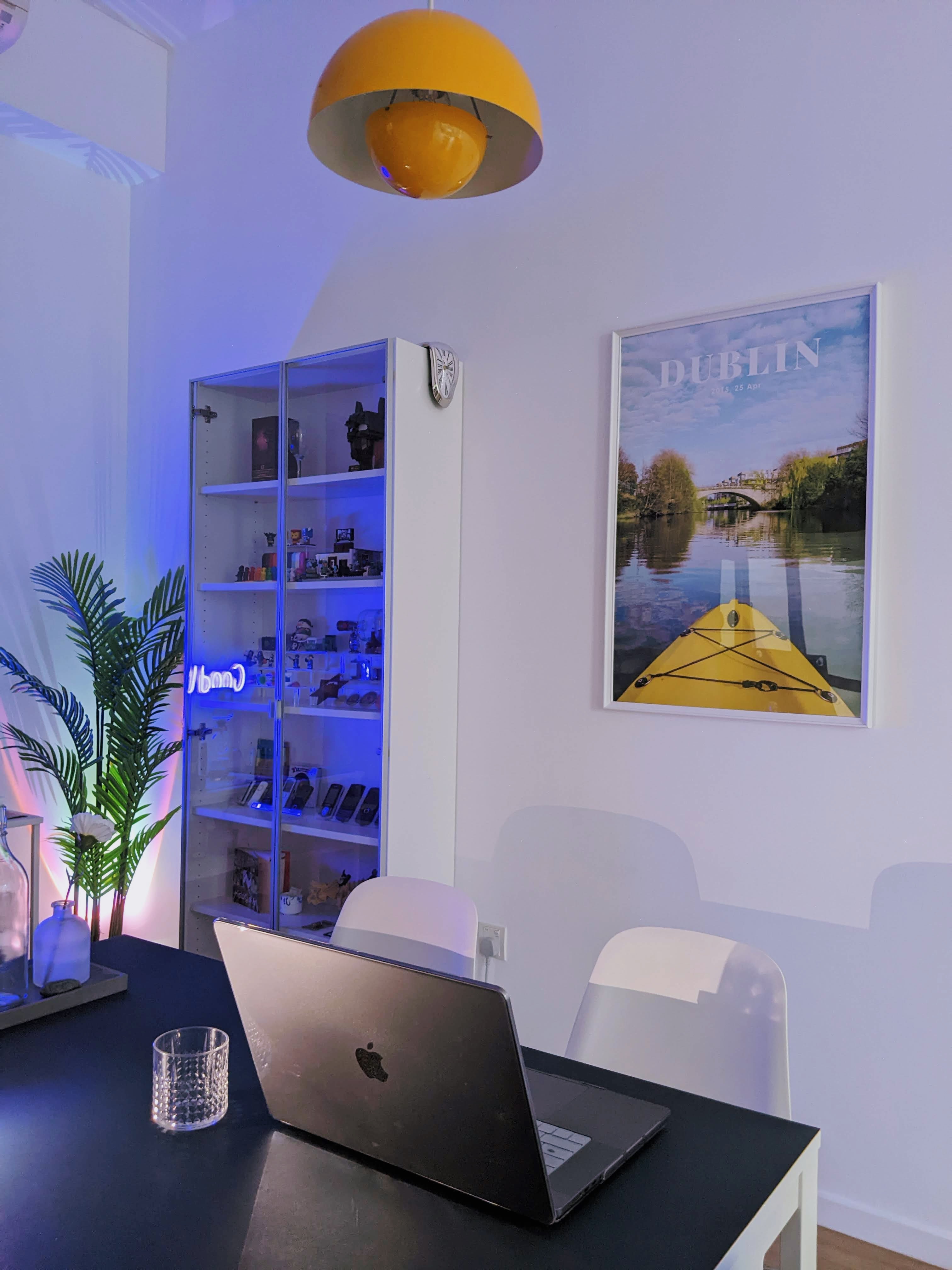 Our Dining Space In The Day, Mini Pool Parlour At Night! - Modern workspace with laptop, blue neon light, yellow kayak