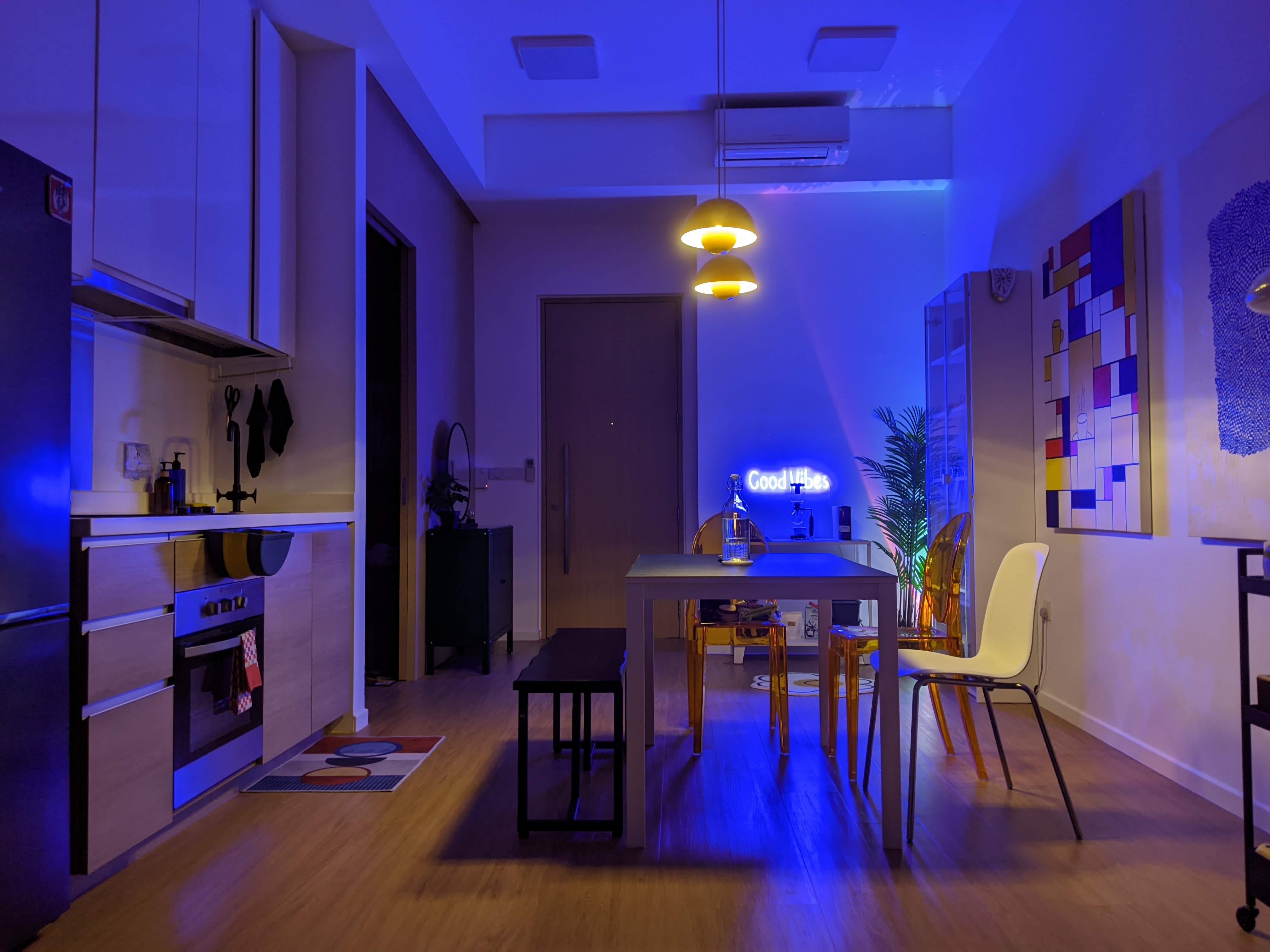 Our Dining Space In The Day, Mini Pool Parlour At Night! - Modern kitchen with blue ambient lighting, sleek appliances