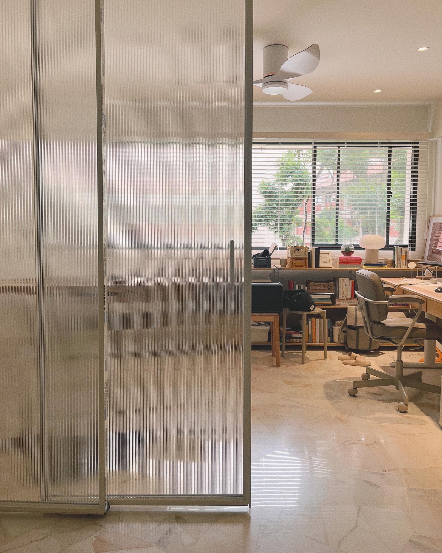 Maximalist, light-filled study with zero built-ins  - Glass partition, office space, modern design, large windows, natural