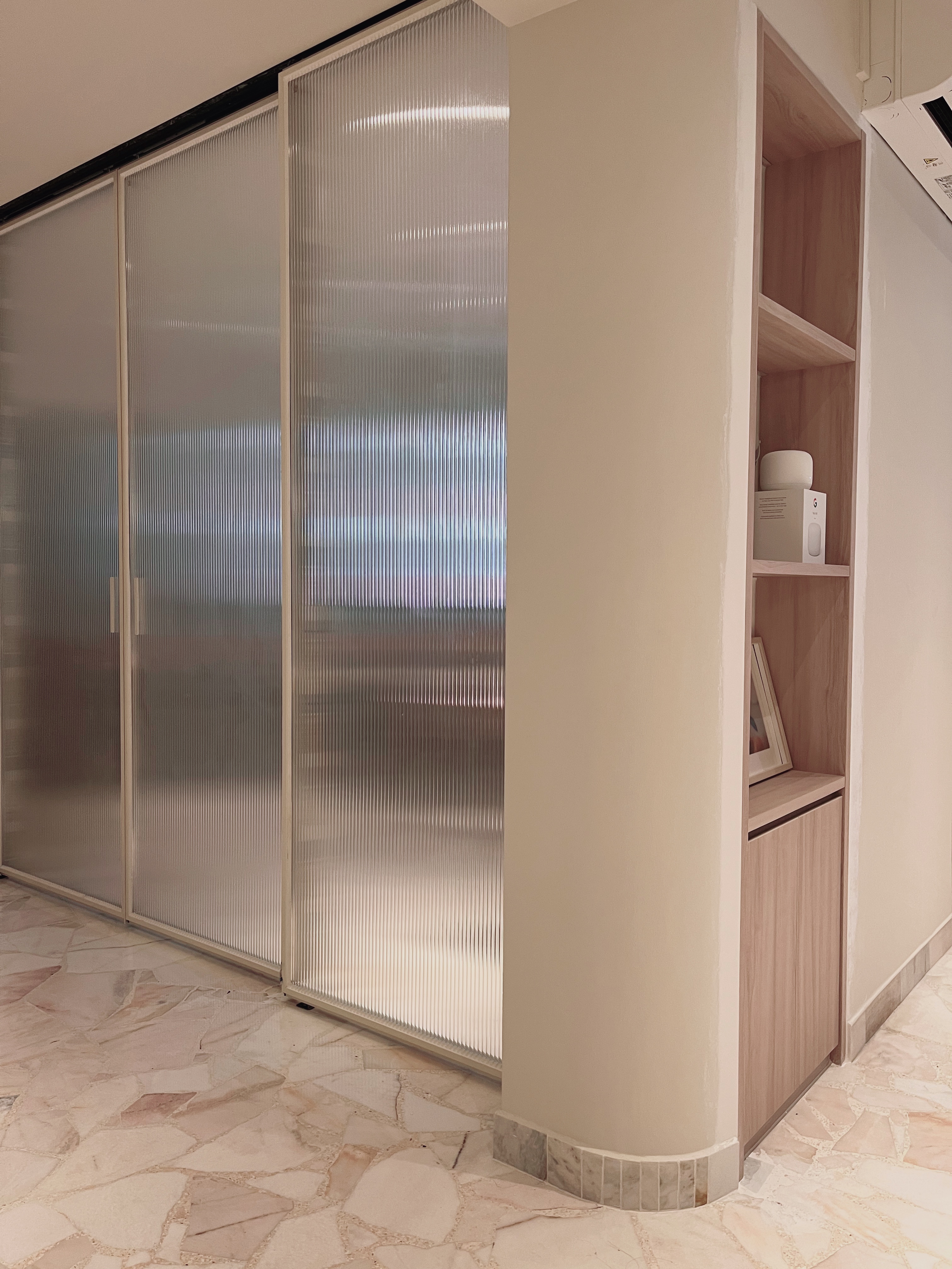 Maximalist, light-filled study with zero built-ins  - Glass partition, wooden shelf, minimalist design, light beige walls