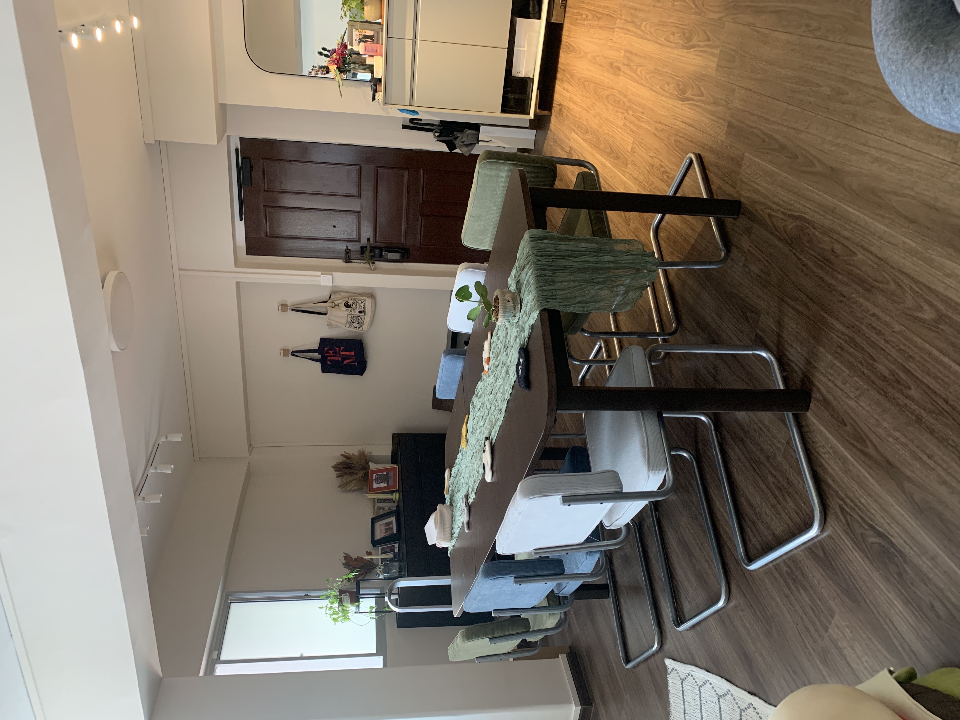 An adaptable open concept dining area - Modern dining room, cozy living space, minimalist decor, wooden flooring, white