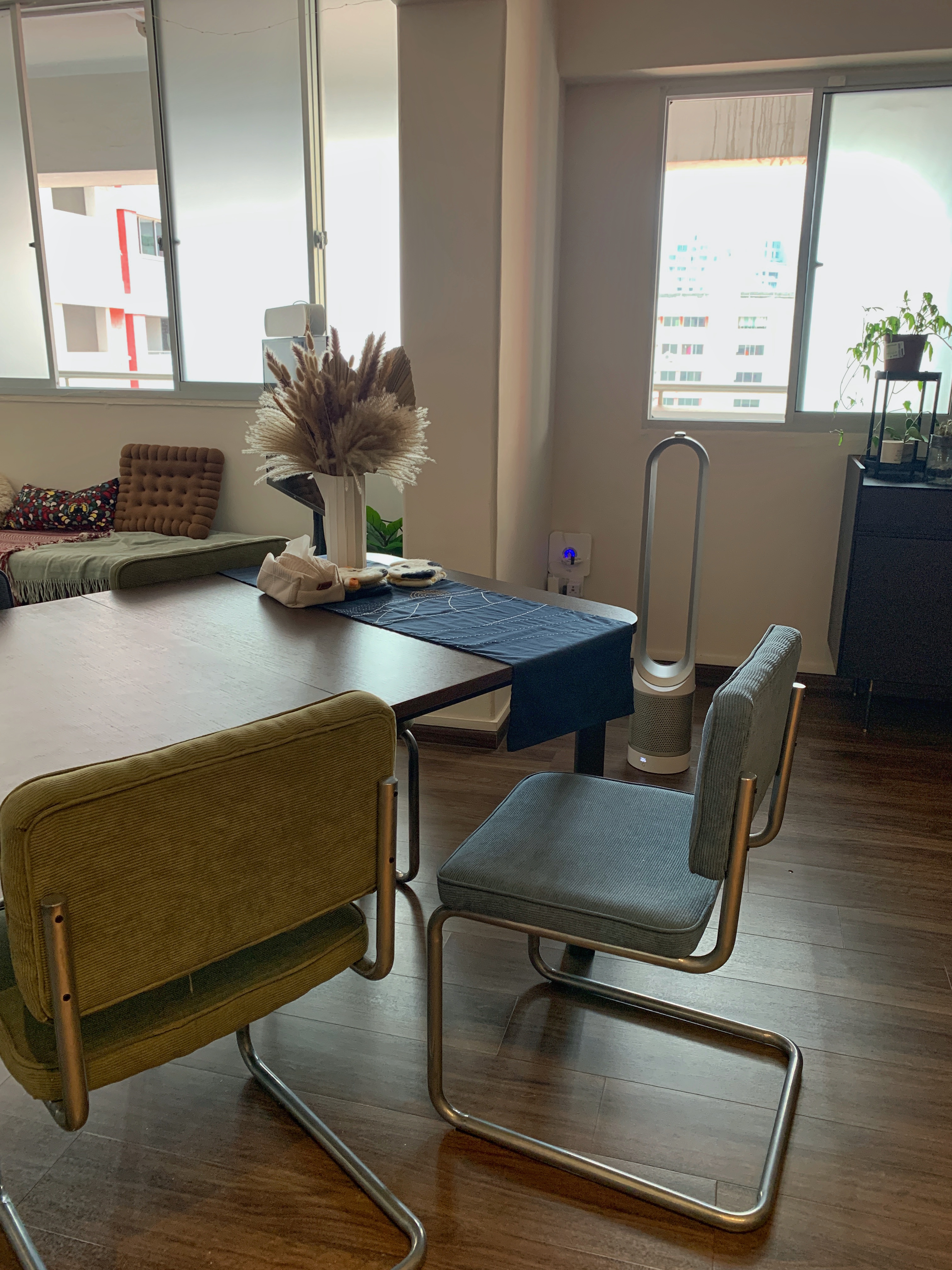 An adaptable open concept dining area - Modern living room, cozy seating area, minimalist design, wooden dining table, green