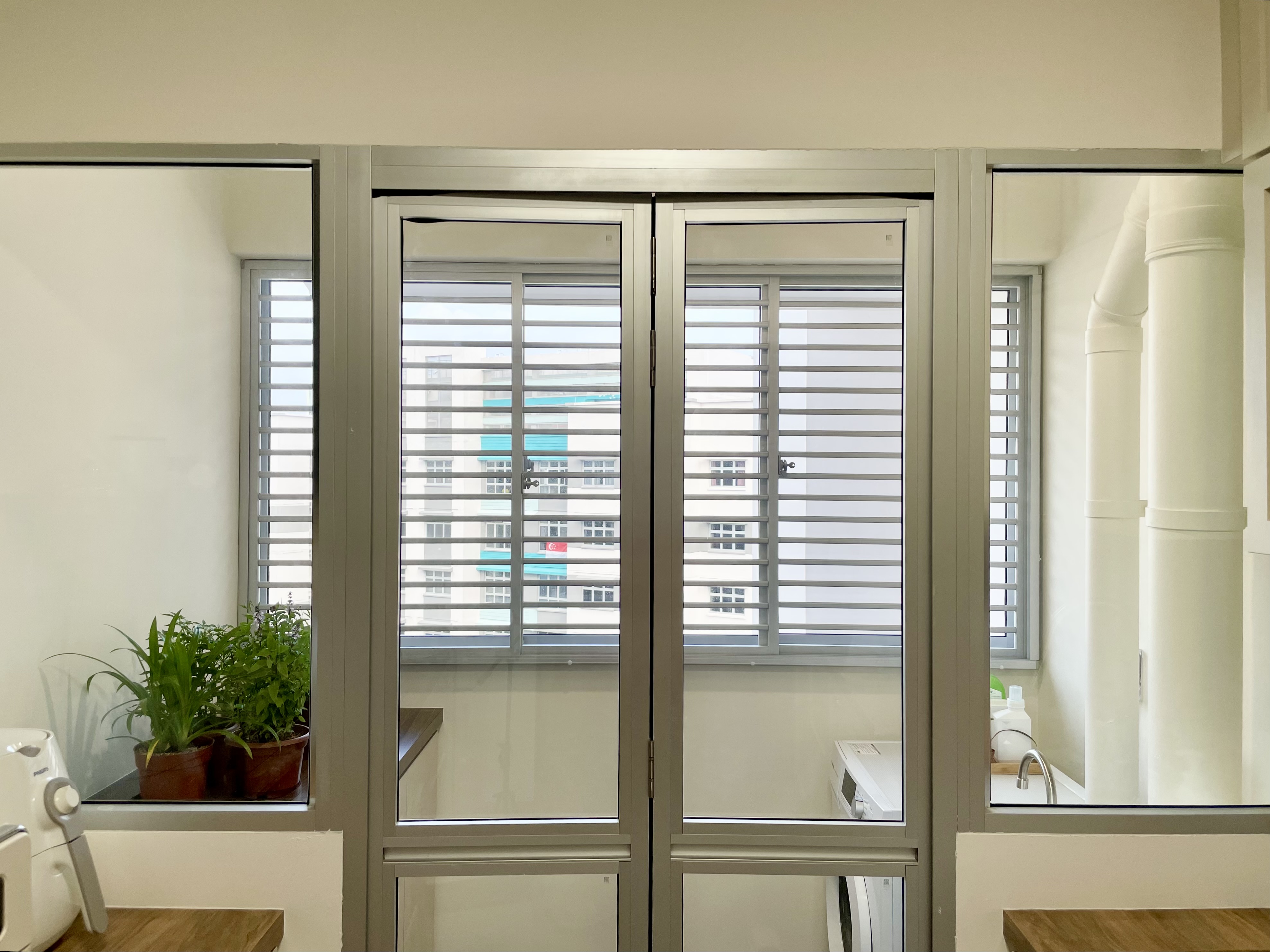 Maximizing your Service Yard - Interesting Sink + Cabinet - Modern minimalist interior, large windows, white blinds, indoor