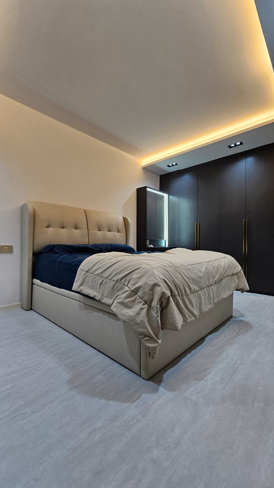 Chic Simplicity: Tranquil Beauty of Grey and White - Modern bedroom with sleek design, beige upholstered headboard, navy blue
