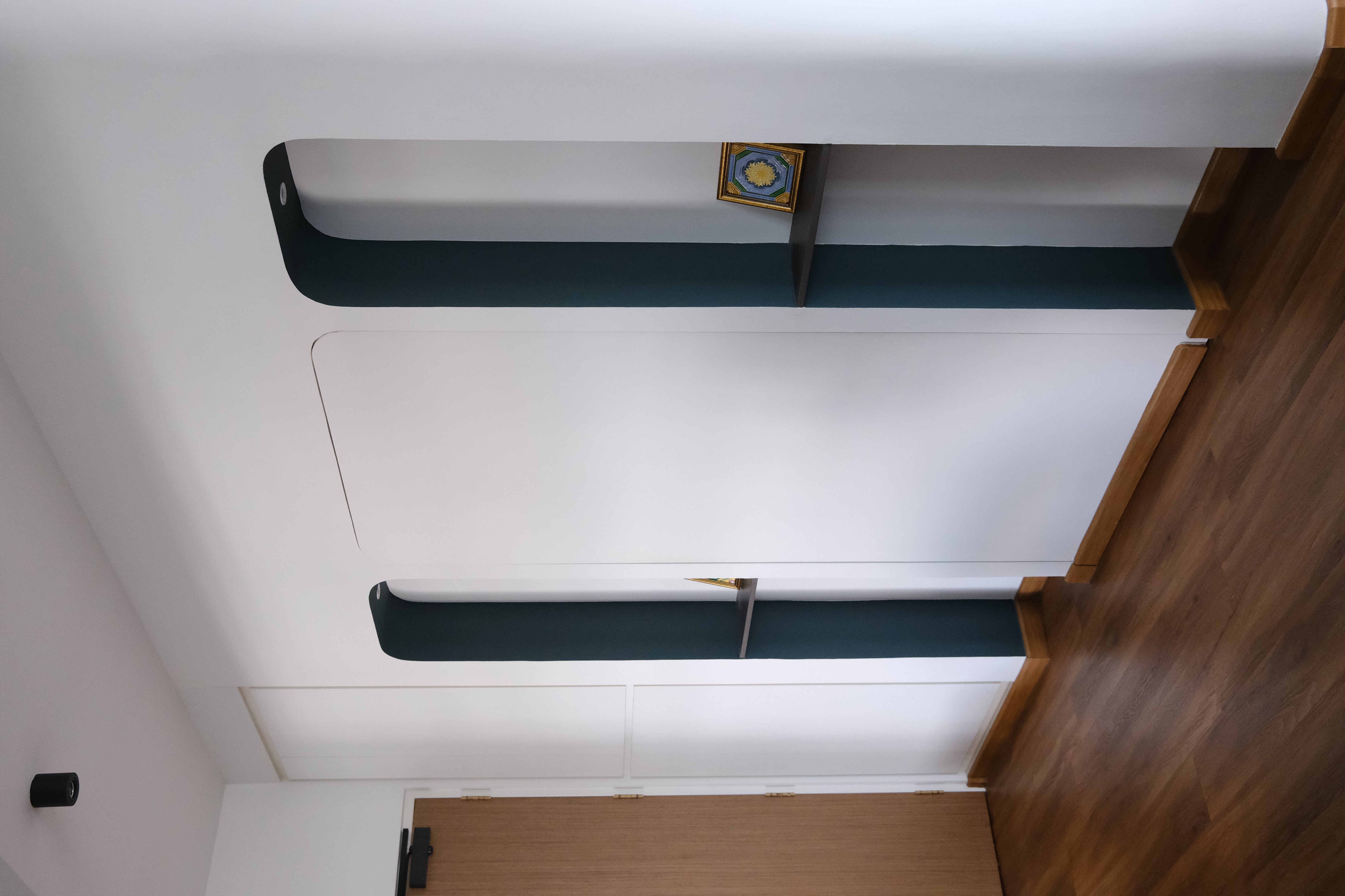 Our Entryway | Where we greet our guests - Modern minimalist interior, sleek ceiling design, white walls, dark green accents