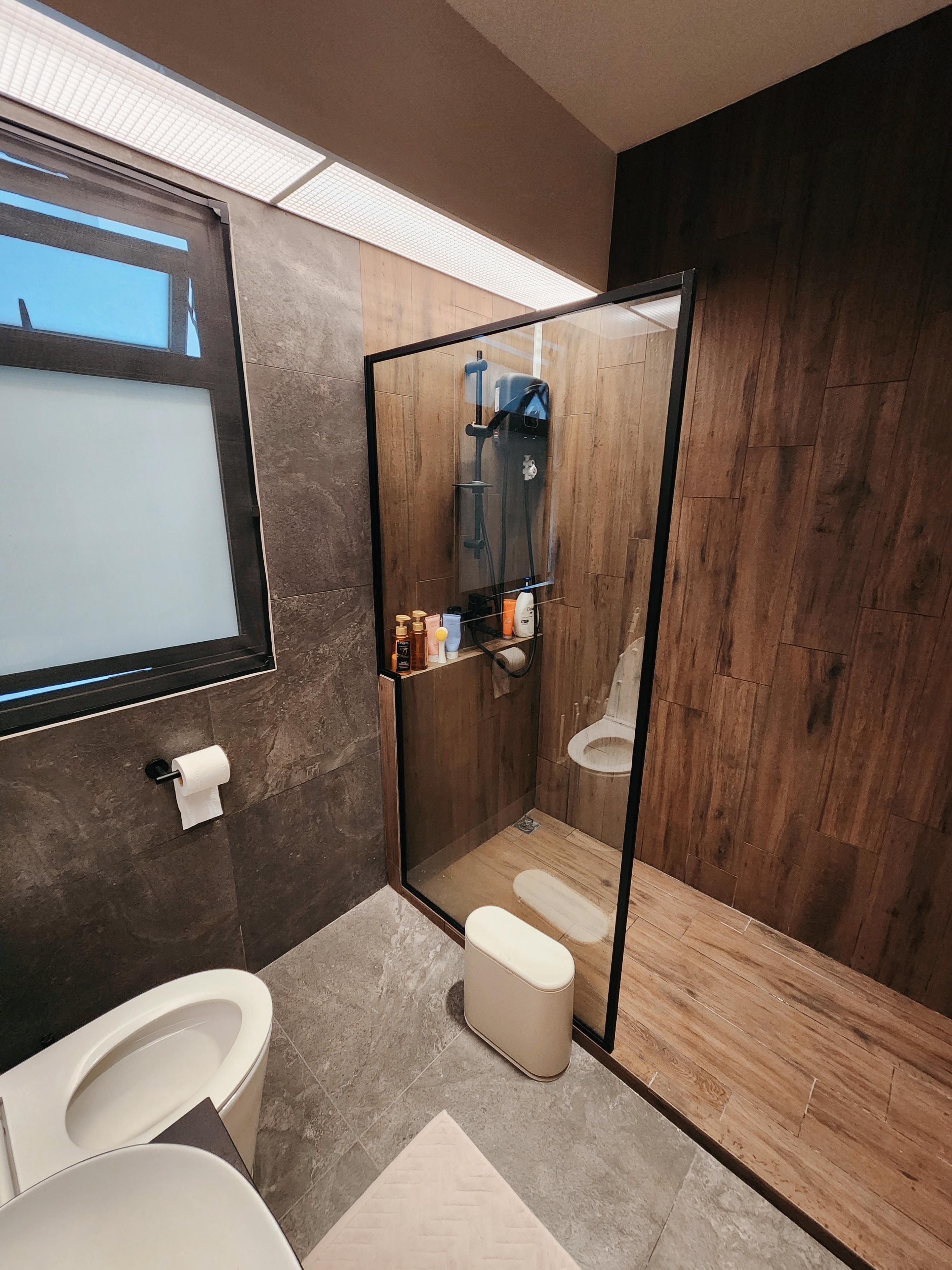 $10k reno for our toilets? Totally worth it!  - Wooden bathroom, modern design, glass shower enclosure, wooden walls, beige