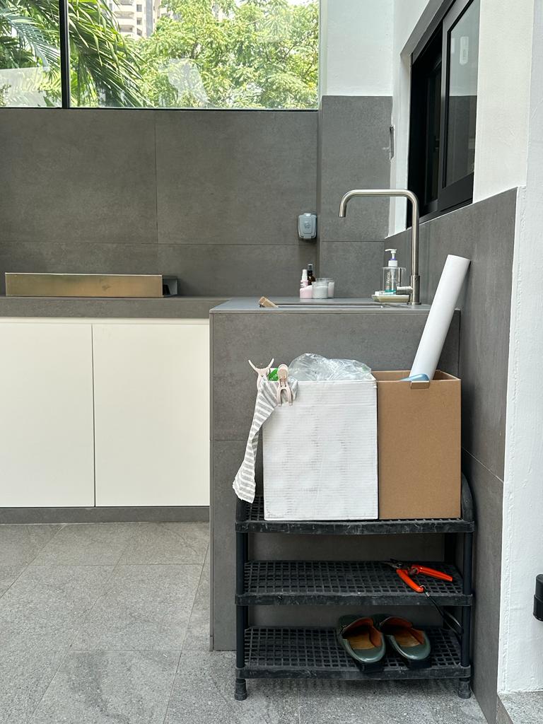 A perfect workflow service yard with no clutter - modern kitchen, gray tiles, minimalist design, white cabinets, stainless