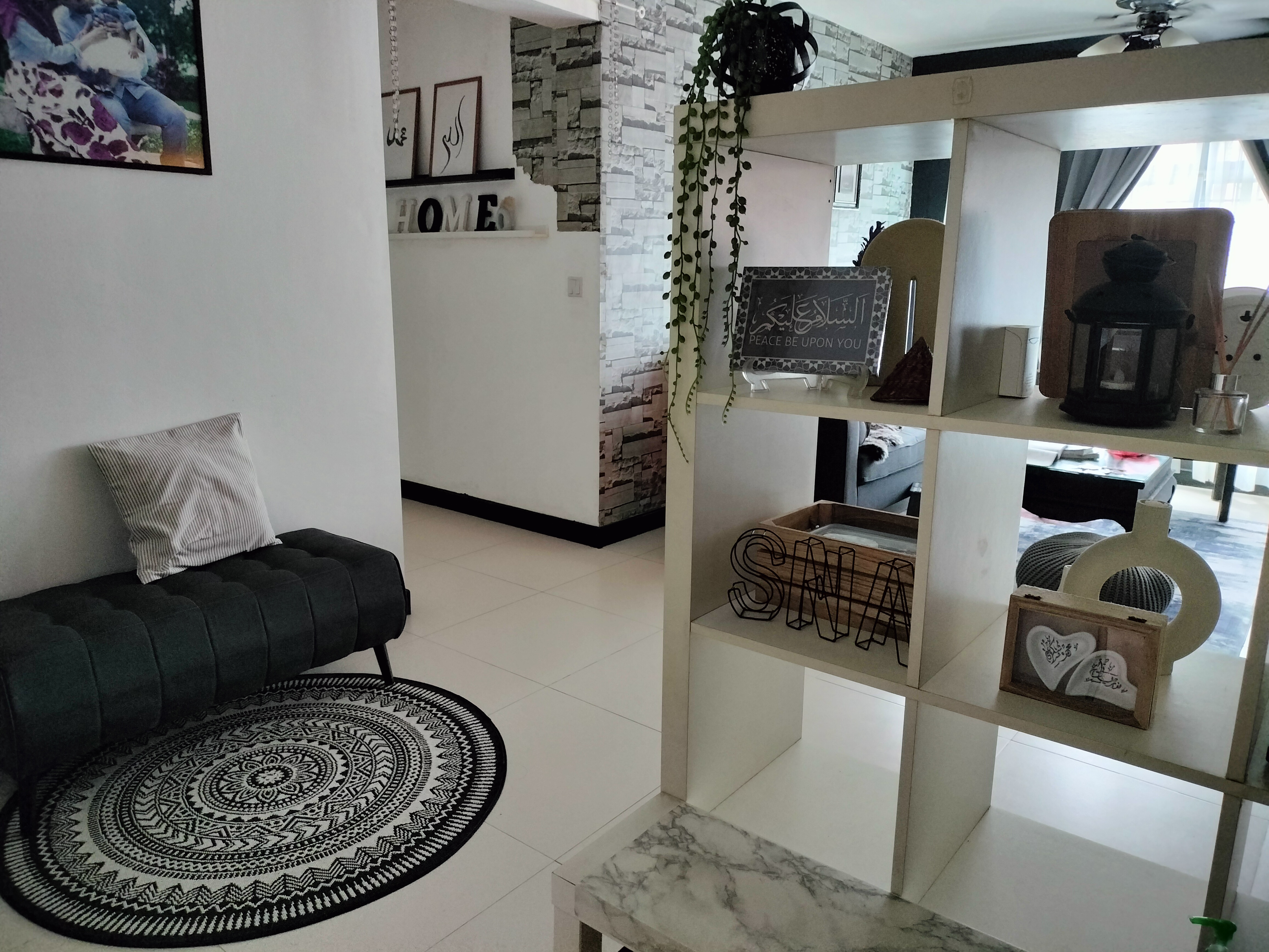 #SGhomestories - Thekilabrets haven👋 - modern living room, cozy seating, black tufted bench, white and black patterned rug