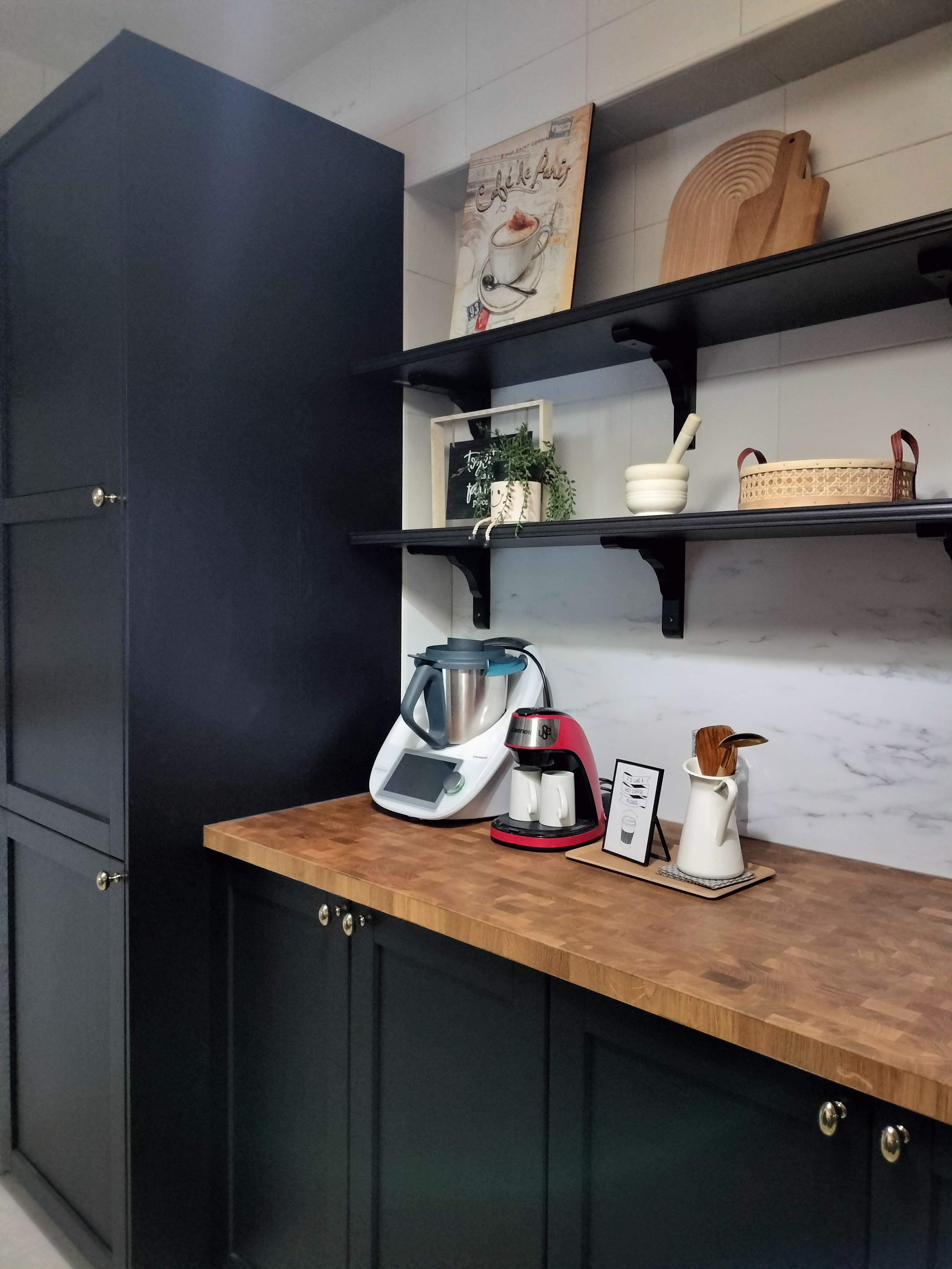 #SGhomestories - Thekilabrets haven👋 - Dark kitchen cabinets, wooden countertop, modern appliances, white and red kitchen