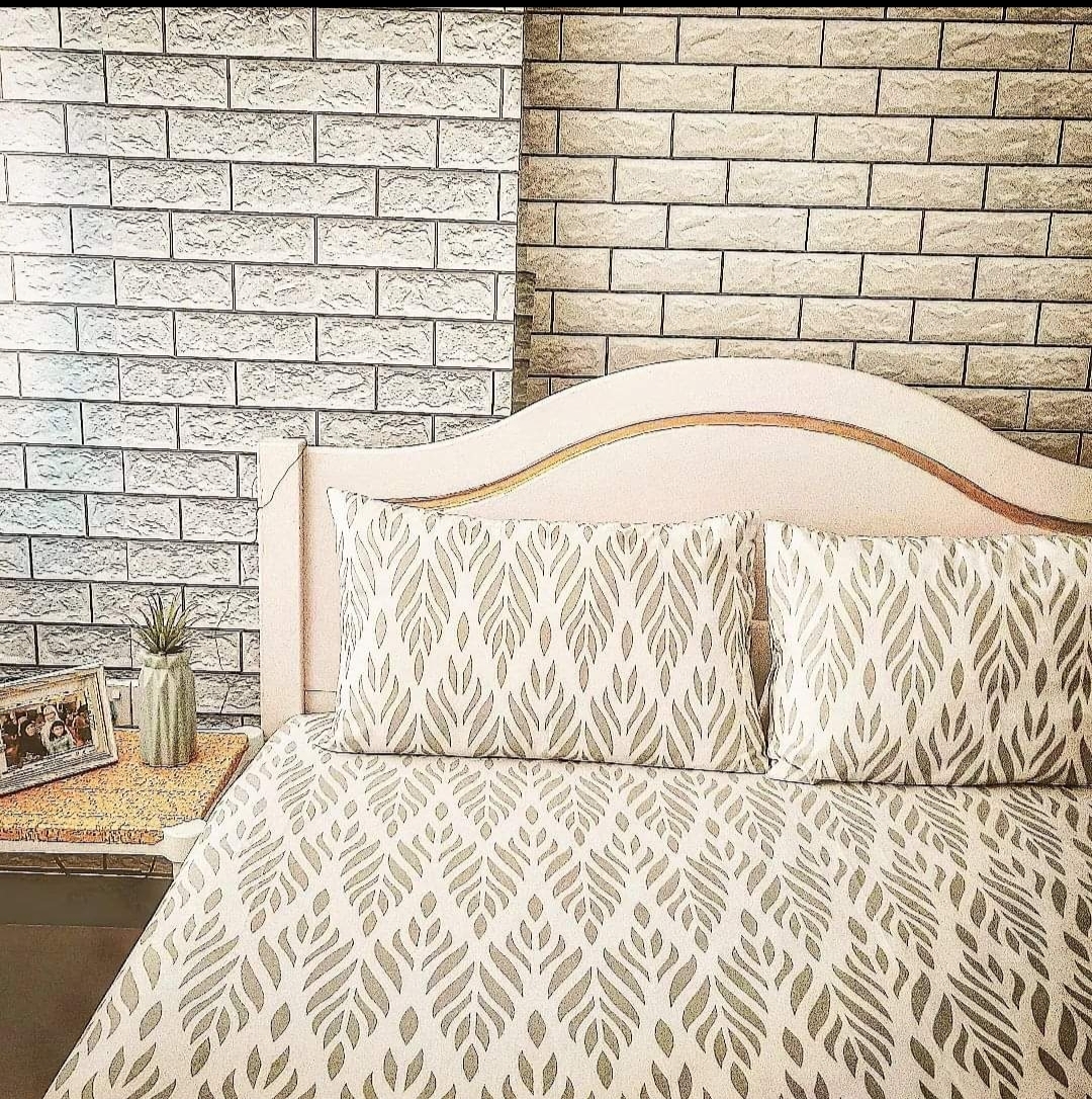 #SGhomestories - Thekilabrets haven👋 - Modern bedroom design featuring a headboard with a curved top and patterned bedding.