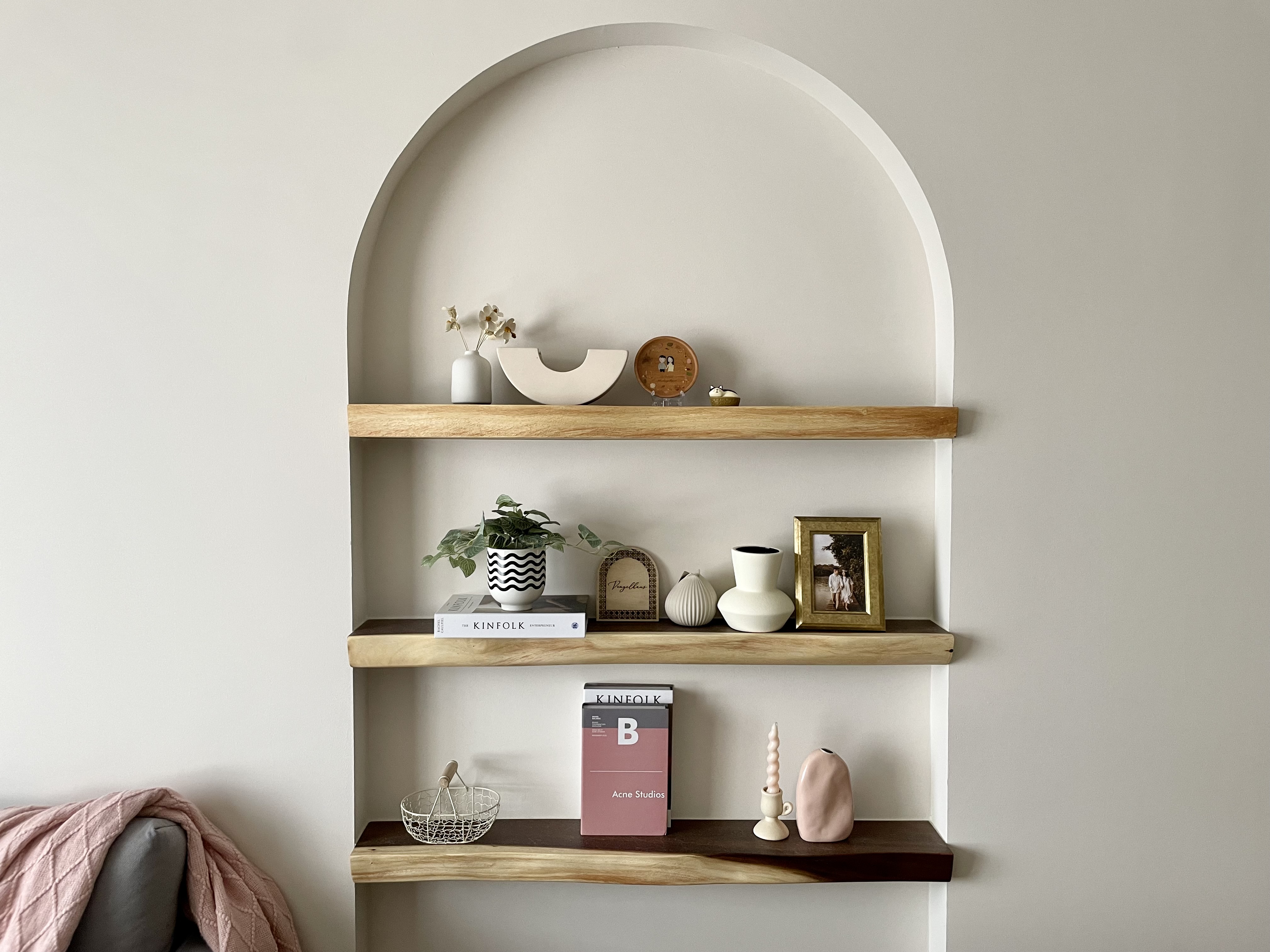 Curves, Wood and Greys in Living Room  - Wooden shelf, minimalist design, arched top, light-colored walls, modern decor