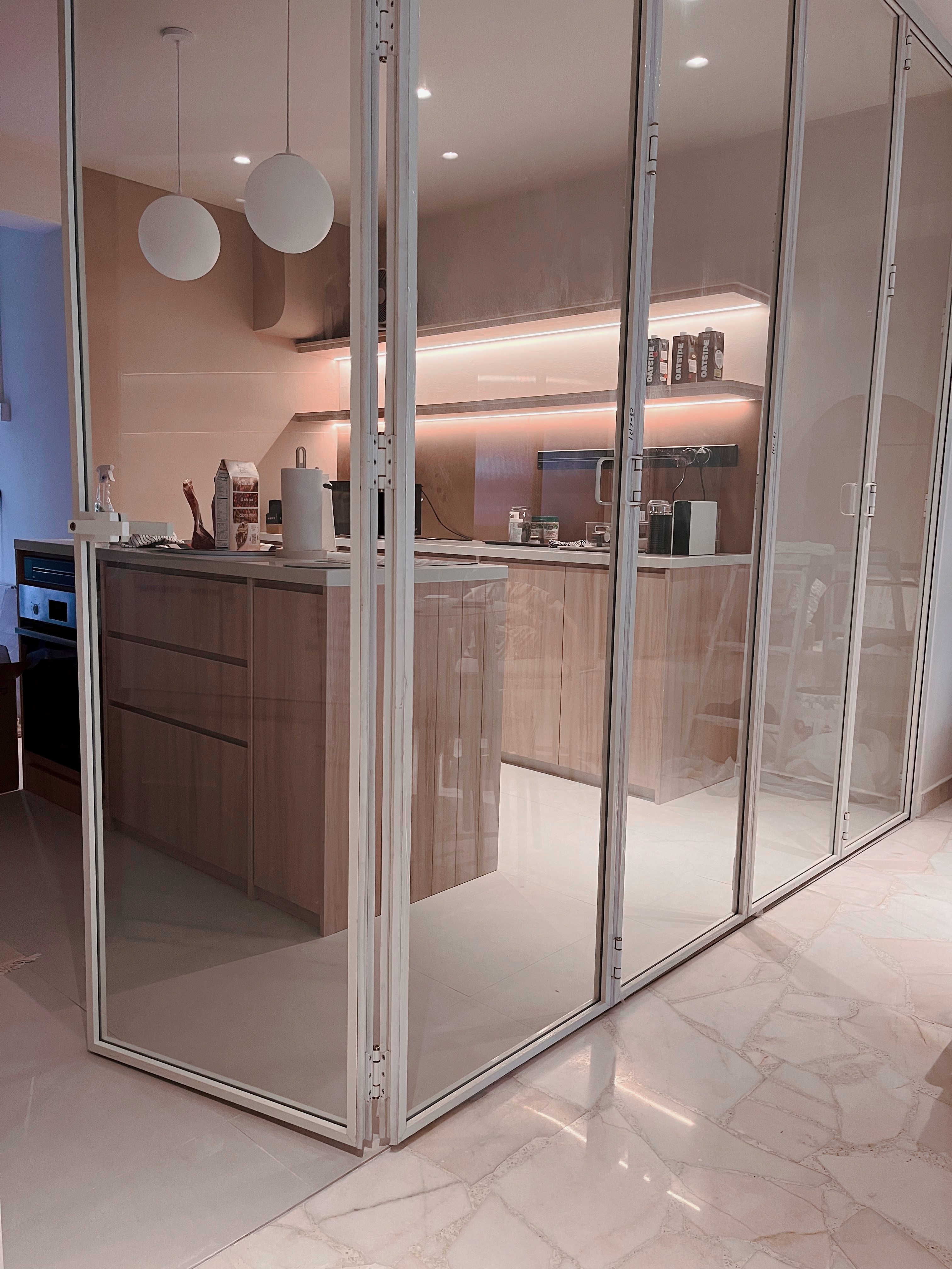 Squarish galley-style kitchen to maximise flow and function - Modern kitchen with glass doors, minimalist design, sleek