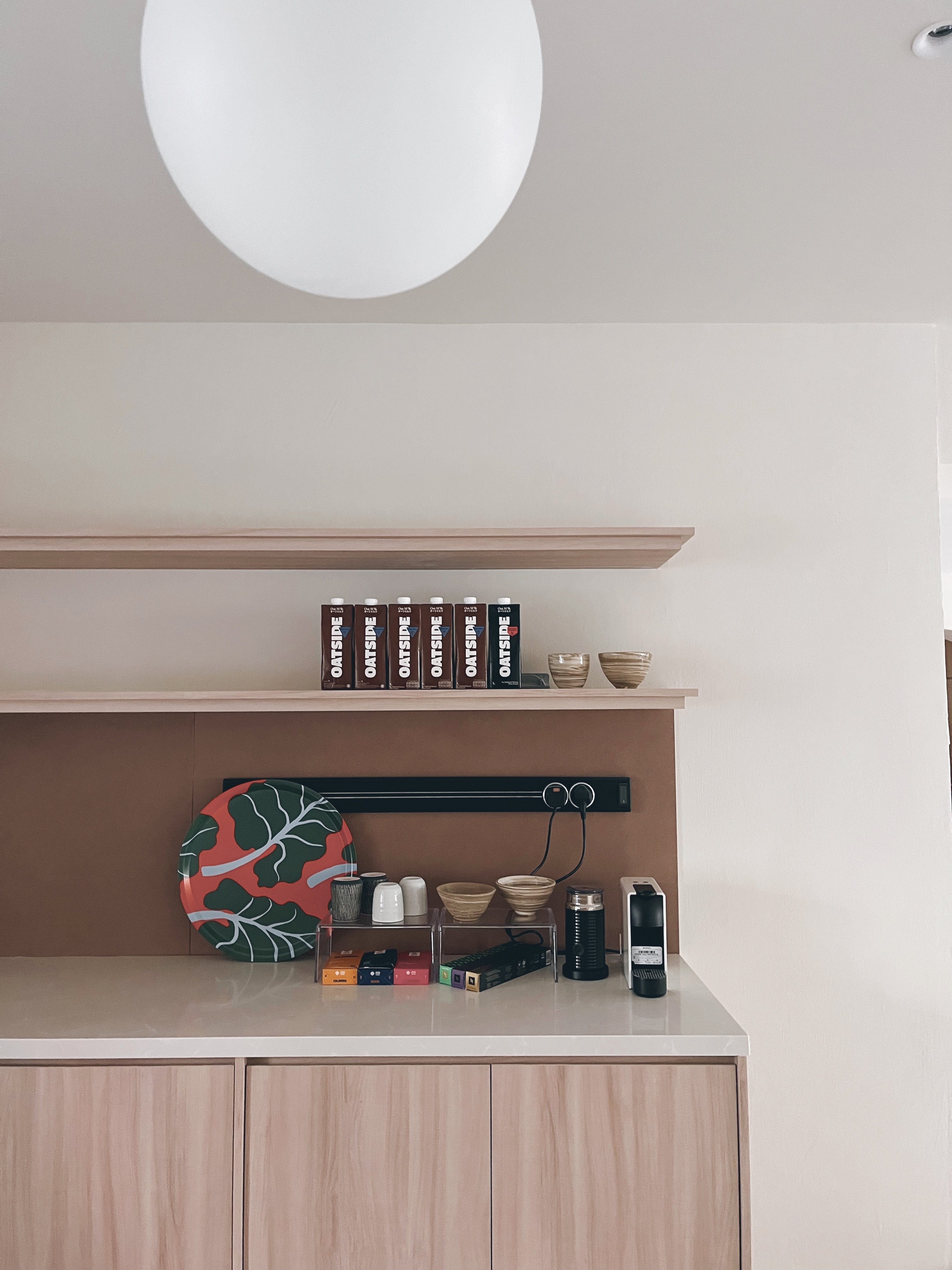 Squarish galley-style kitchen to maximise flow and function - Oatmeal, coffee, shelf, bowls, coffee maker, coffee beans