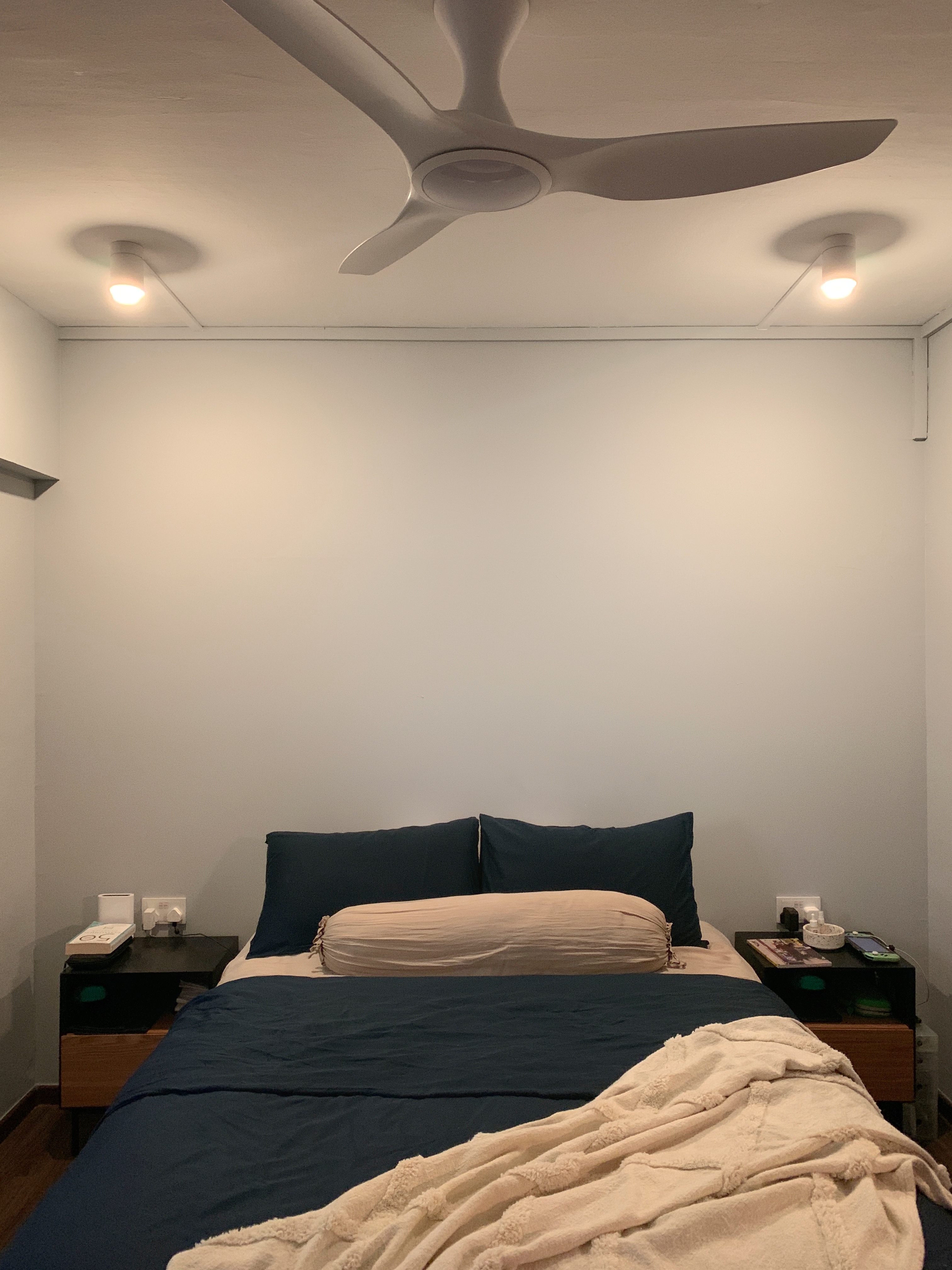 A minimal bedroom with a walk-in wardrobe nook
