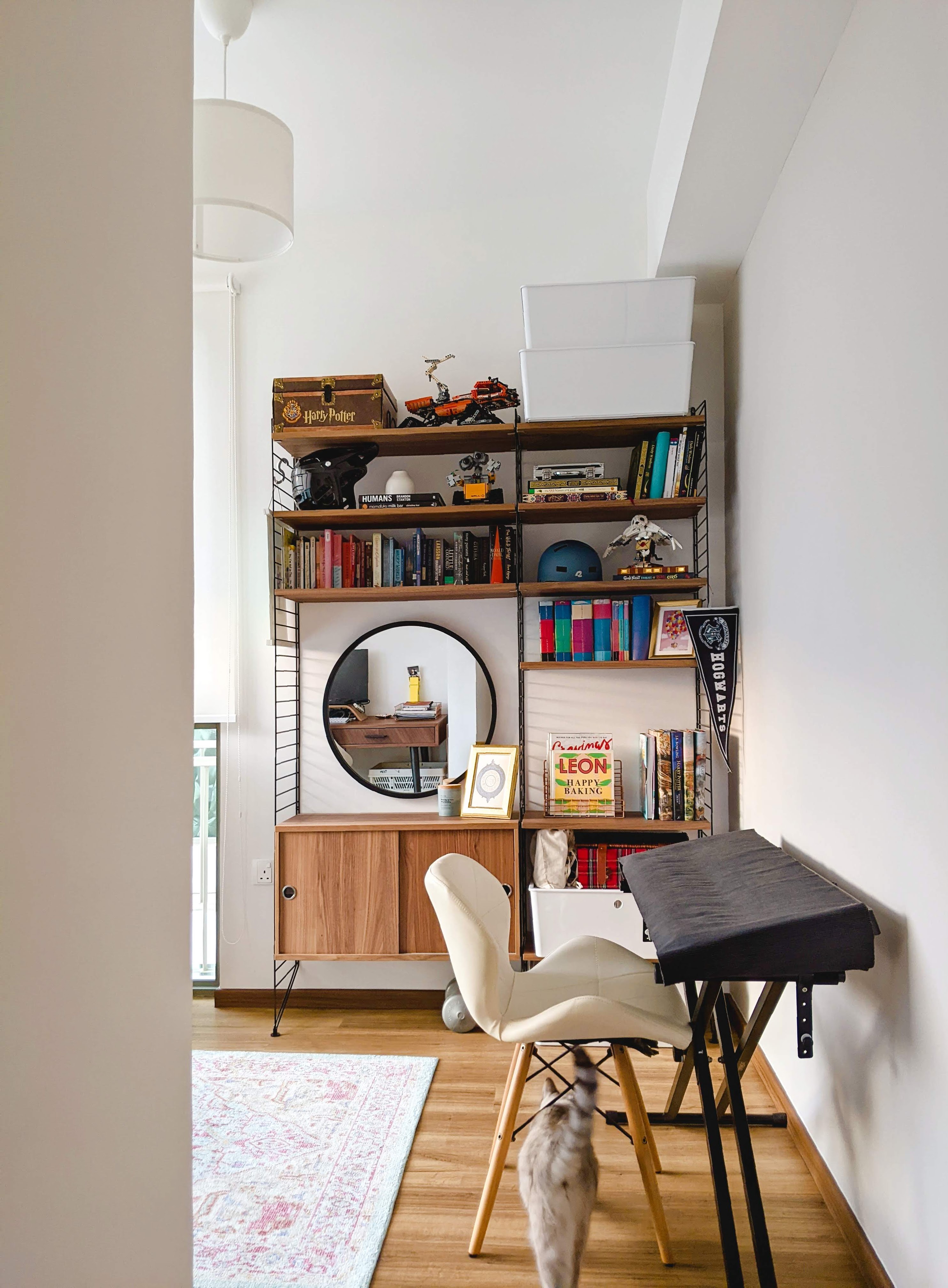 Walk about our quirky, catto-loving space. - Wooden bookshelf, Harry Potter box, Lego model, books, Batman figurine, Star