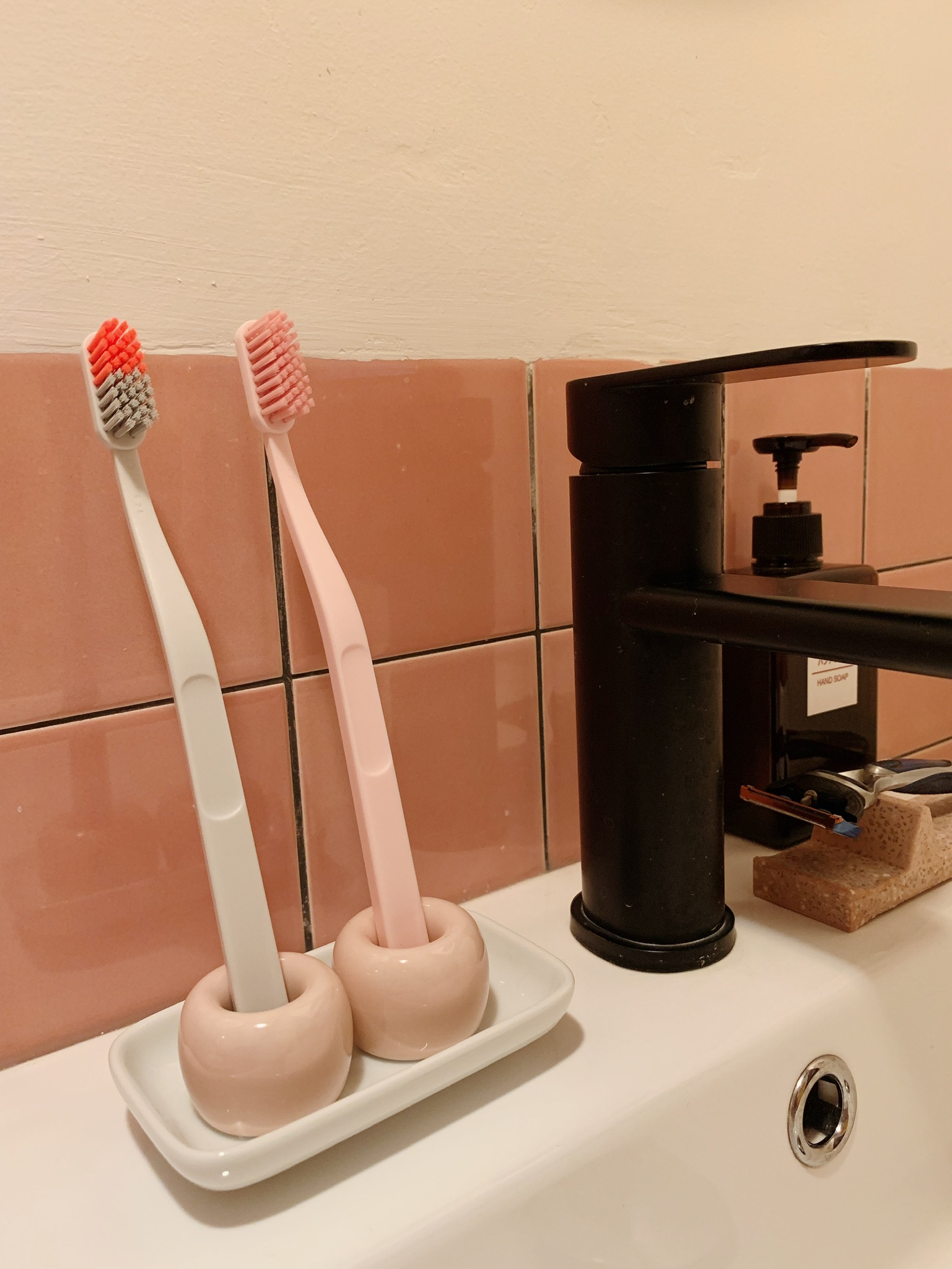 Where Every Bathroom Break is a Mini Getaway! - Toothbrushes, pink and white, ceramic, holder, bathroom, sink, white and