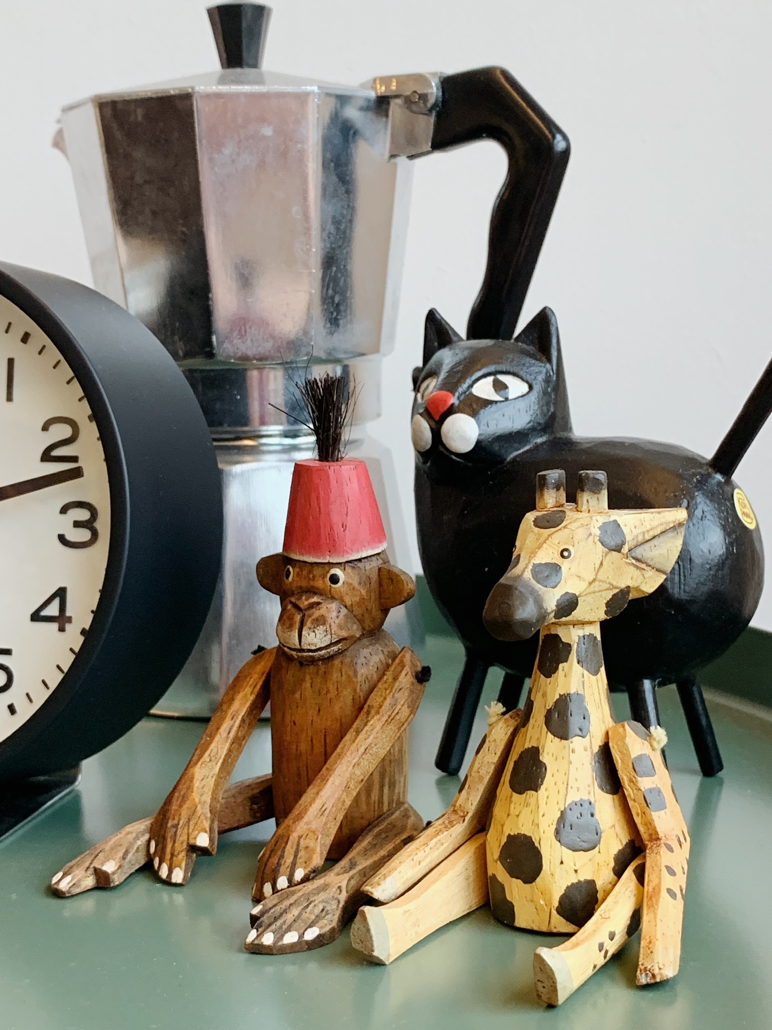 From Living Room to Entertainment Central: The Ultimate Transformation - wooden animal figurines, black cat, giraffe, monkey