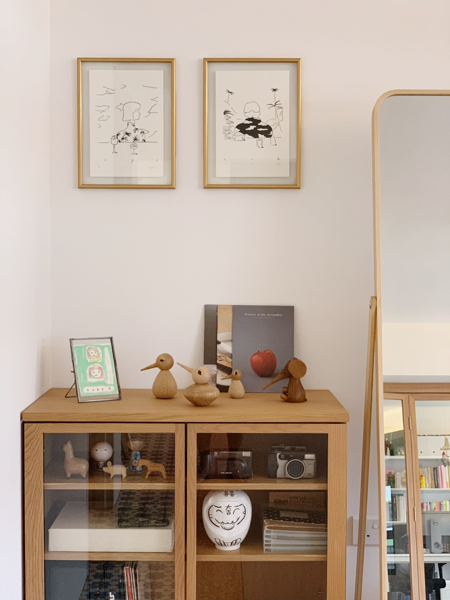 From Living Room to Entertainment Central: The Ultimate Transformation - Wooden cabinet, glass doors, minimalist decor