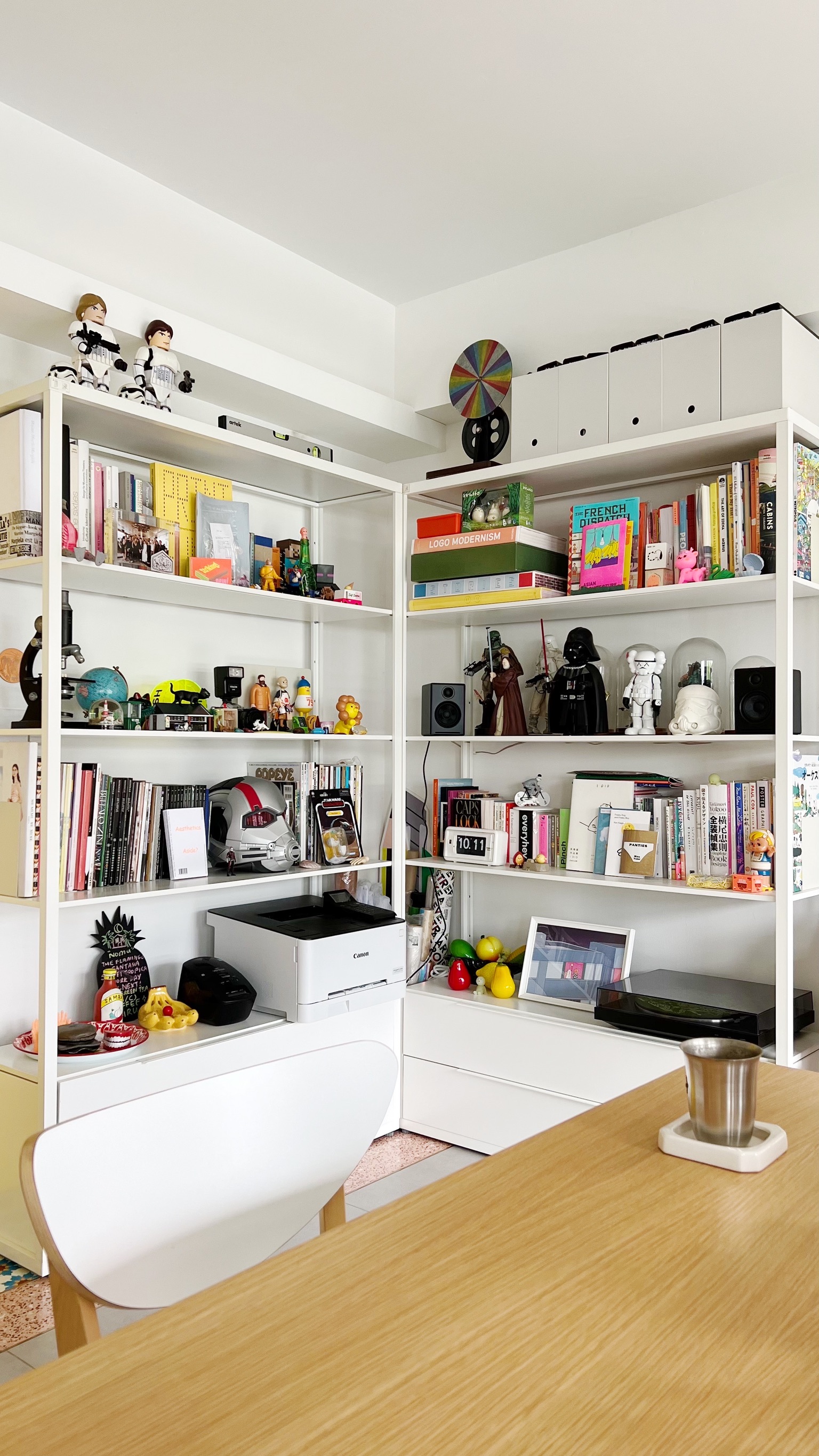 Epic Feasts and Growing Bonds: Our Dining Table's Journey to Grandeur - White bookshelf, colorful toys, Darth Vader figurine