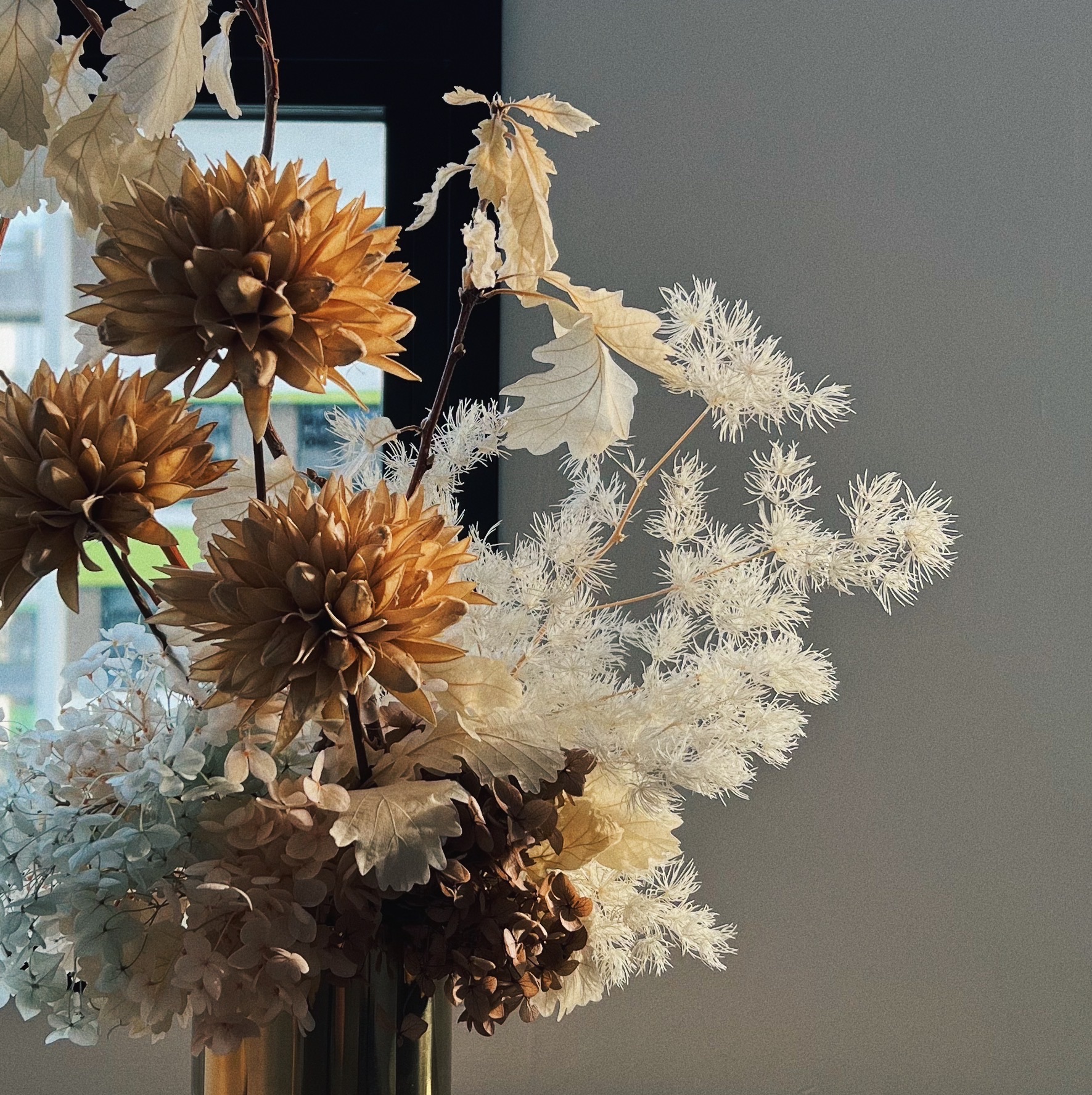 Epic Feasts and Growing Bonds: Our Dining Table's Journey to Grandeur - golden flowers, white flowers, dried leaves, autumn