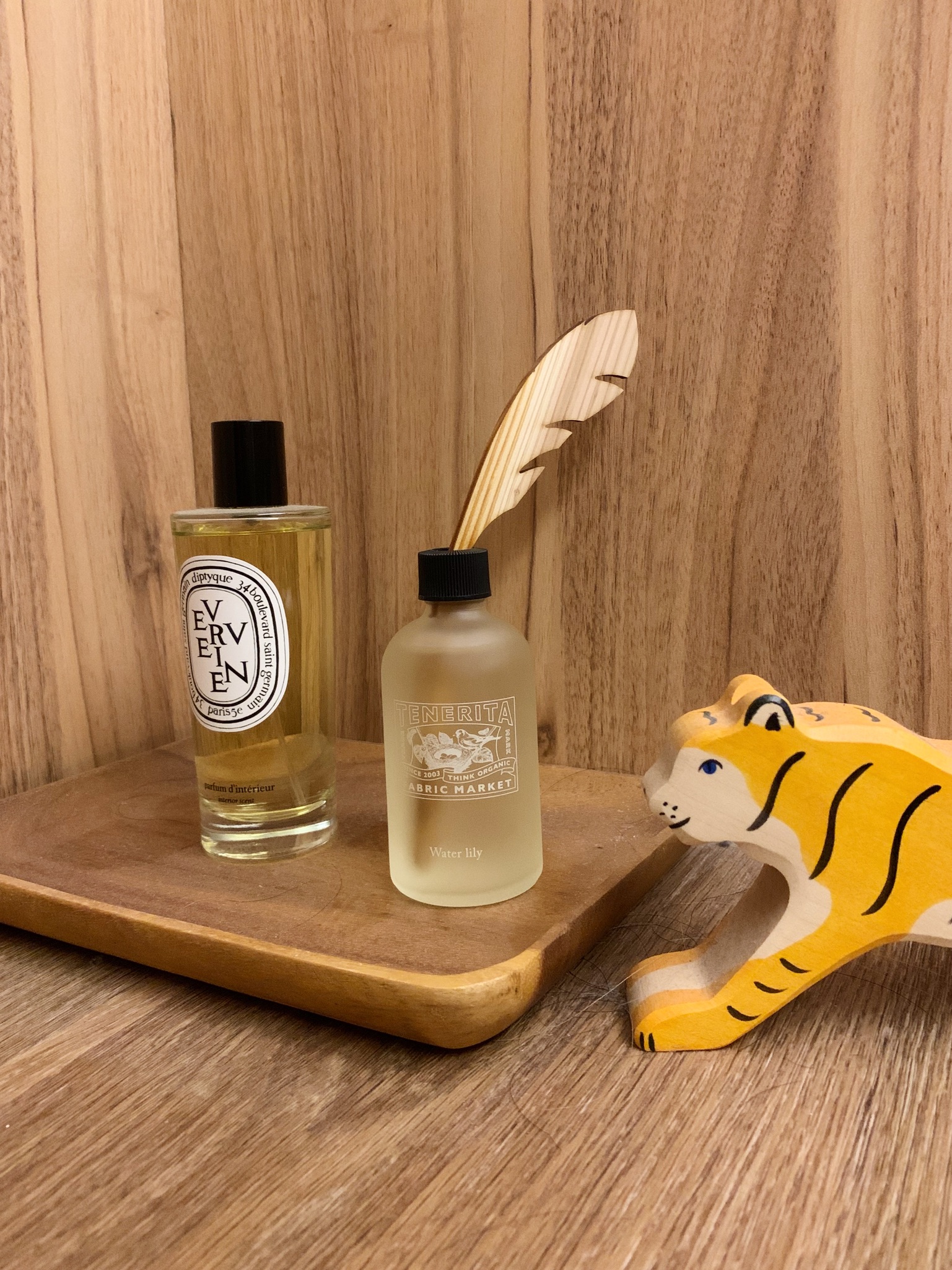 Transitioning From Communal Haven to Your Personal Quiet Retreat - wooden tray, perfume bottles, EYEN and TENERITA, yellow