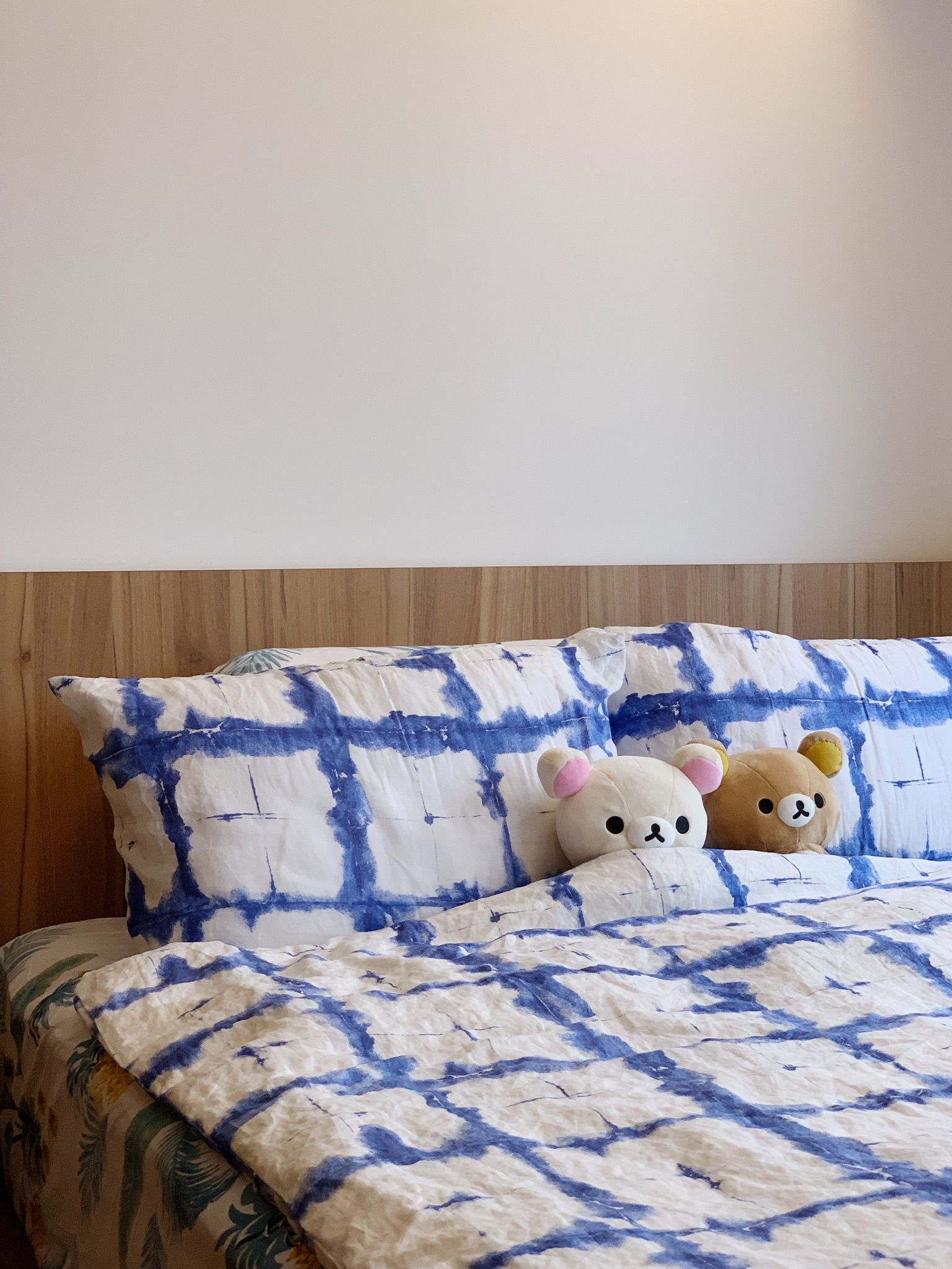 Transitioning From Communal Haven to Your Personal Quiet Retreat - Blue and white patterned comforter, plush teddy bears
