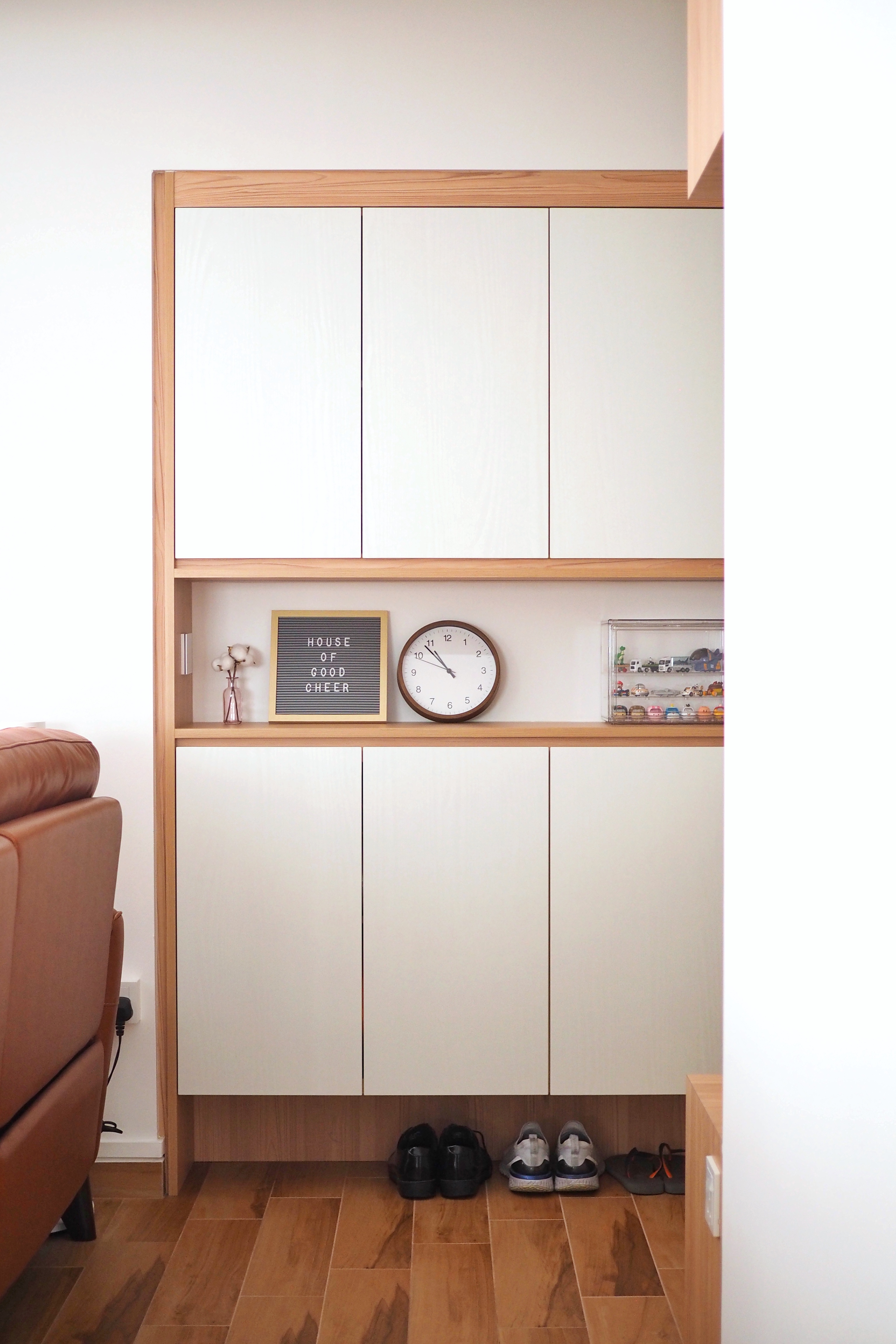 Maximising Space at Our Entryway - Wooden cabinet, white interior, wooden trim, light wood finish, minimalist design