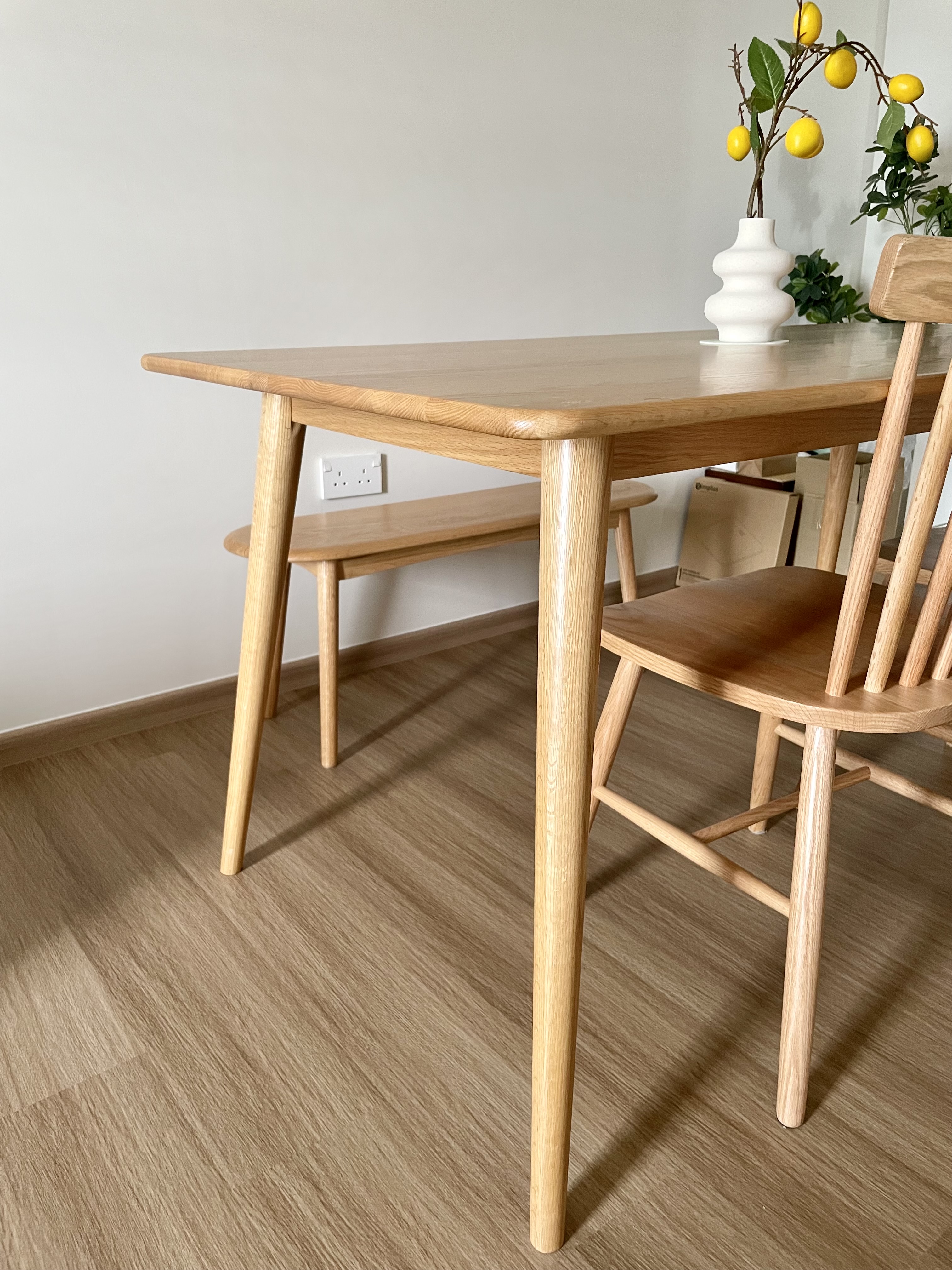 Japandi style dining area  - Light wooden dining table, minimalist design, natural wood finish, wooden chair, simple decor