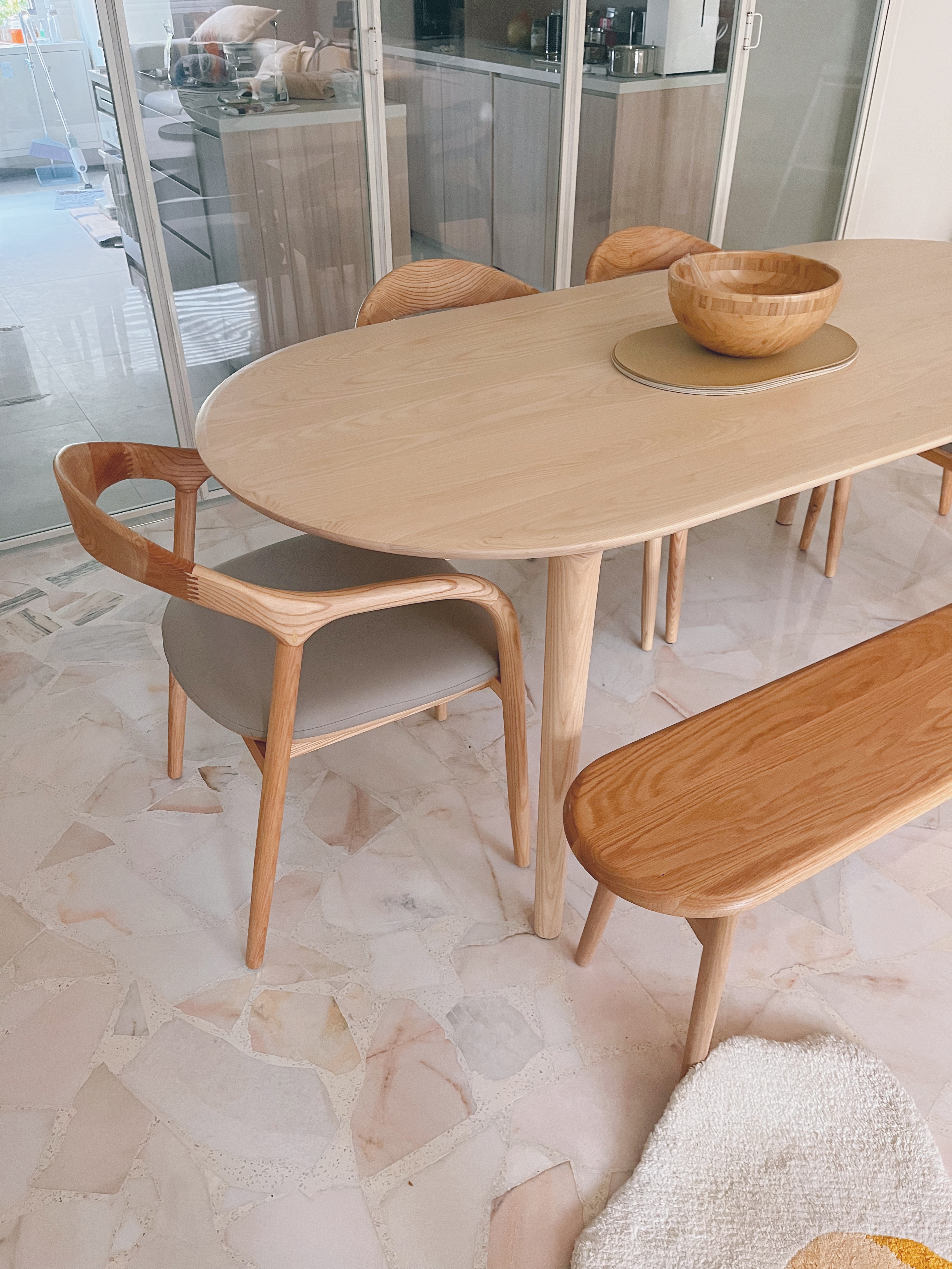 Versatility to gather with those who matter - Modern minimalist dining room, light wood dining table, wooden chairs, soft