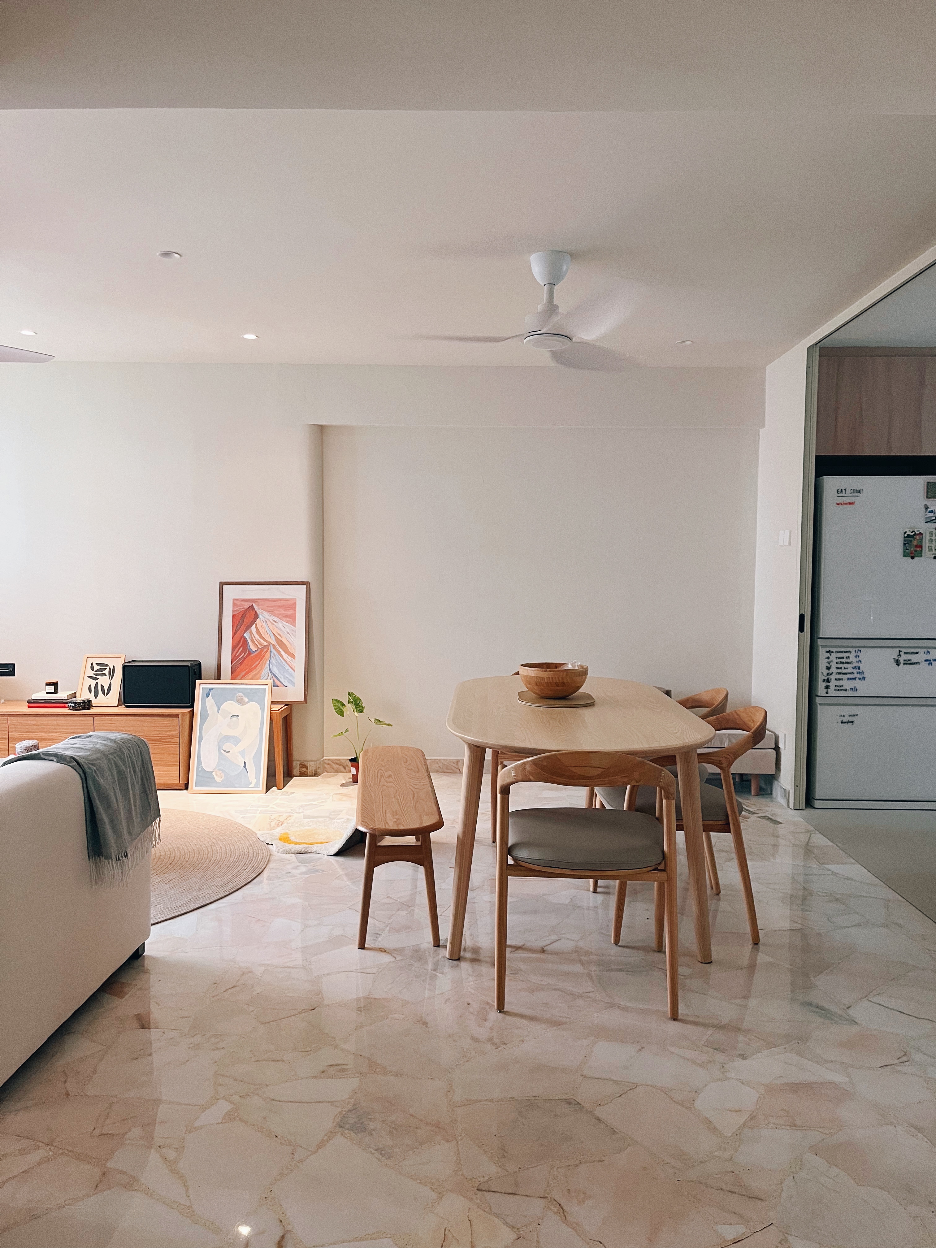 Versatility to gather with those who matter - Modern minimalist living room, cozy dining area, light-colored marble floor