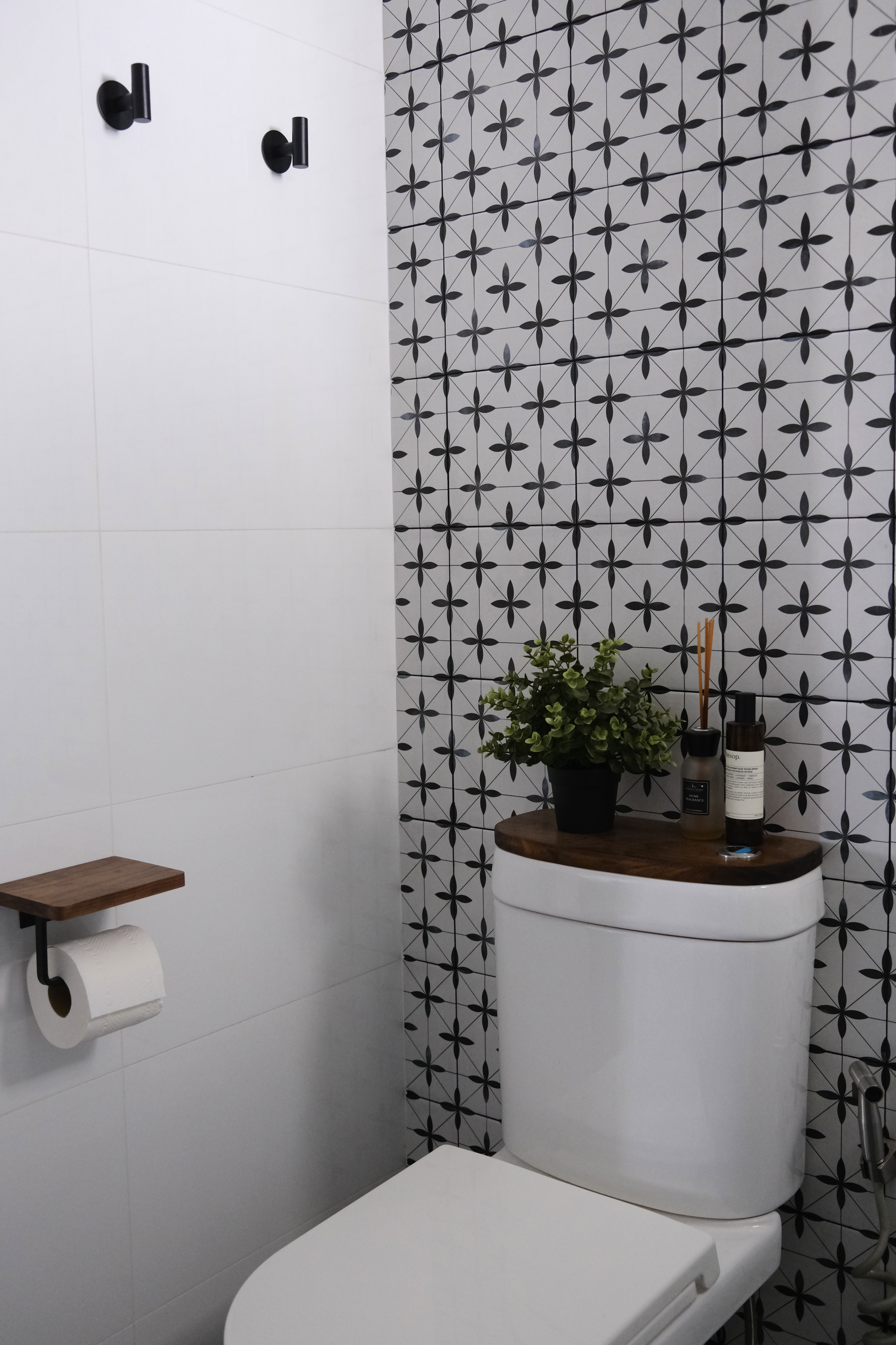 Our Bathroom | Where we freshen up  - White tiled wall, black wall-mounted fixtures, modern bathroom design, white toilet