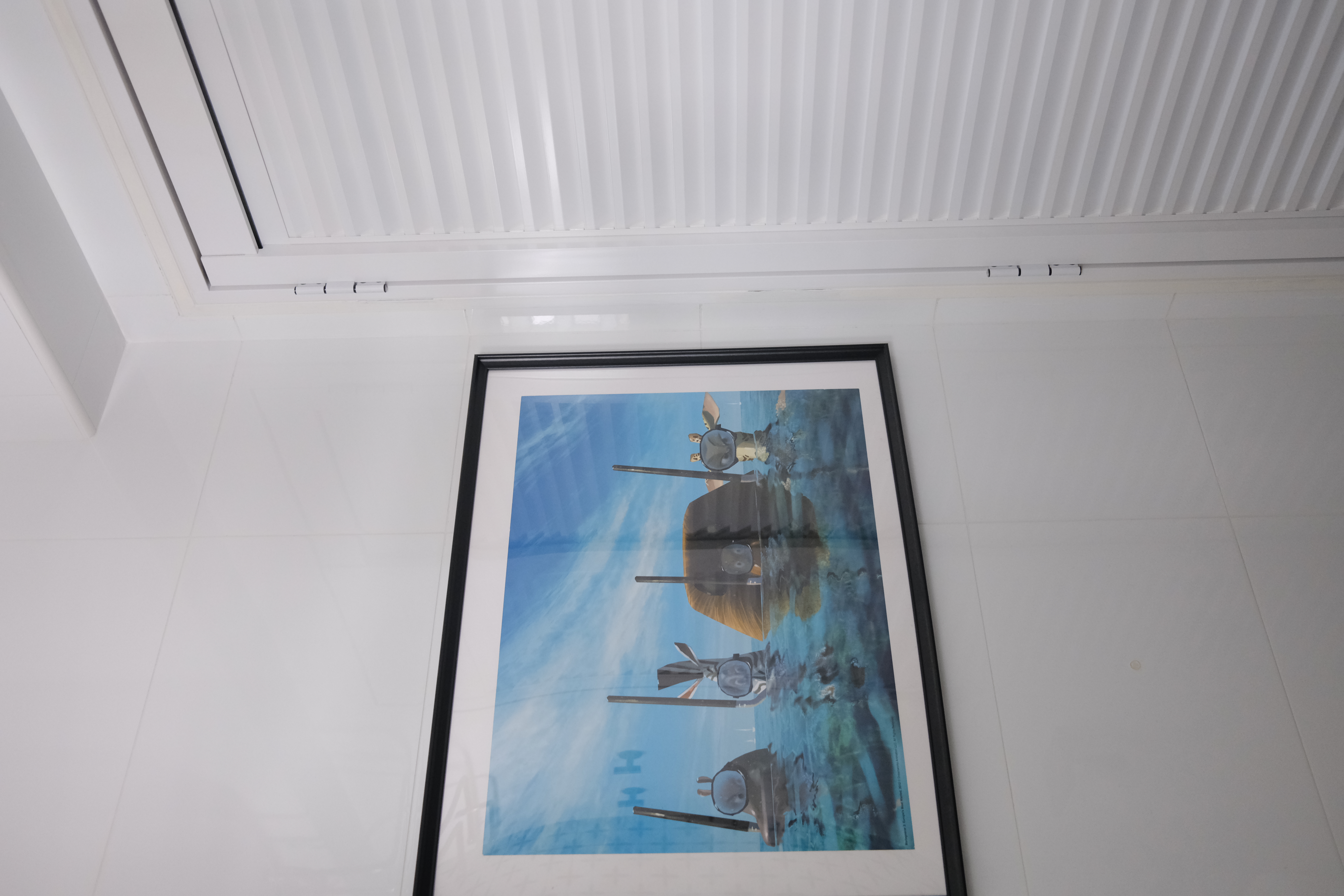 Our Bathroom | Where we freshen up  - White tiled floor, Framed artwork, Blue sky background, Three submarines, Submarines