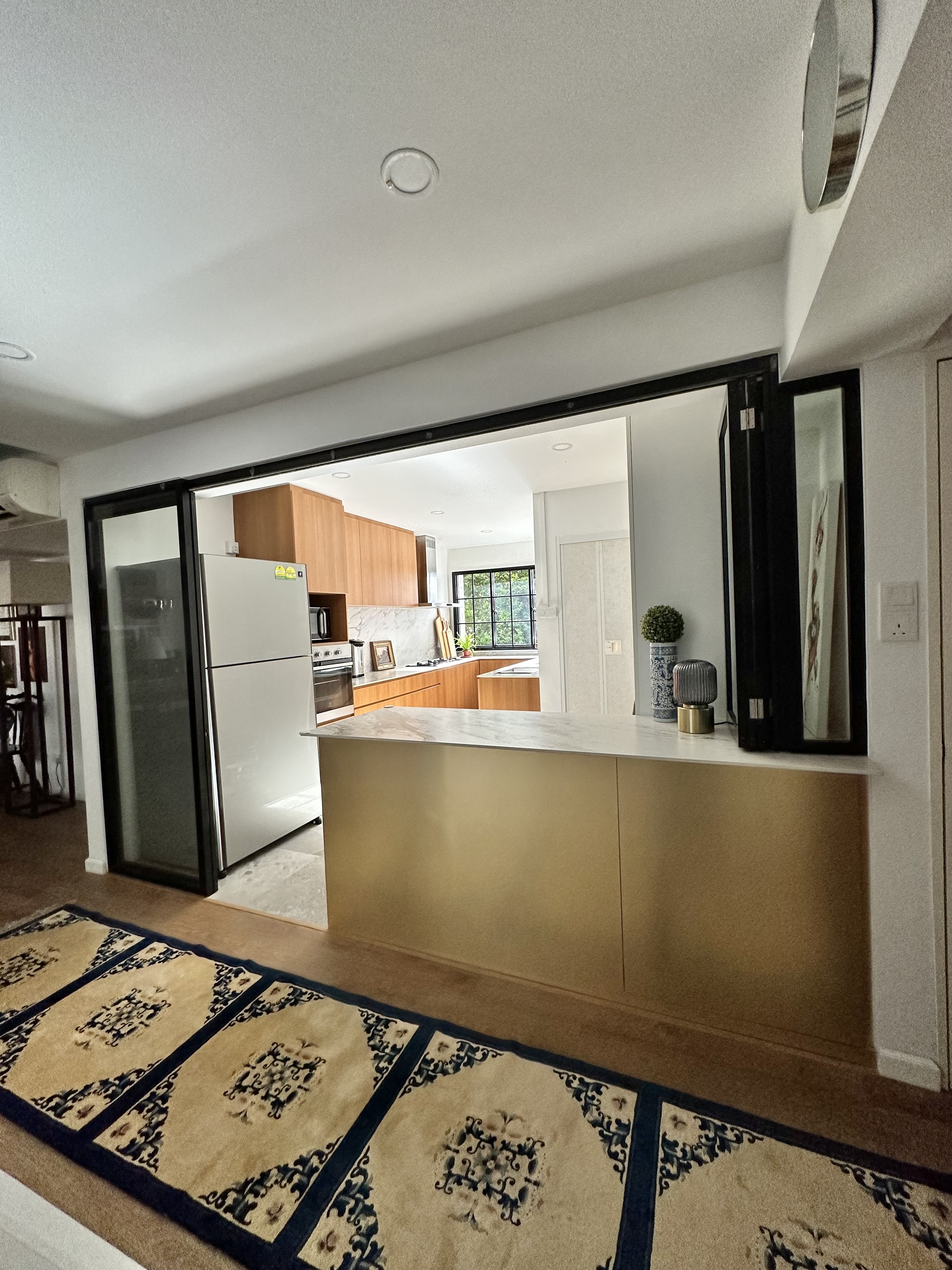 Kitchen Reno: Hacking Walls and Moving Bathroom Door for Maximum Flow - Modern kitchen with sleek design, stainless steel