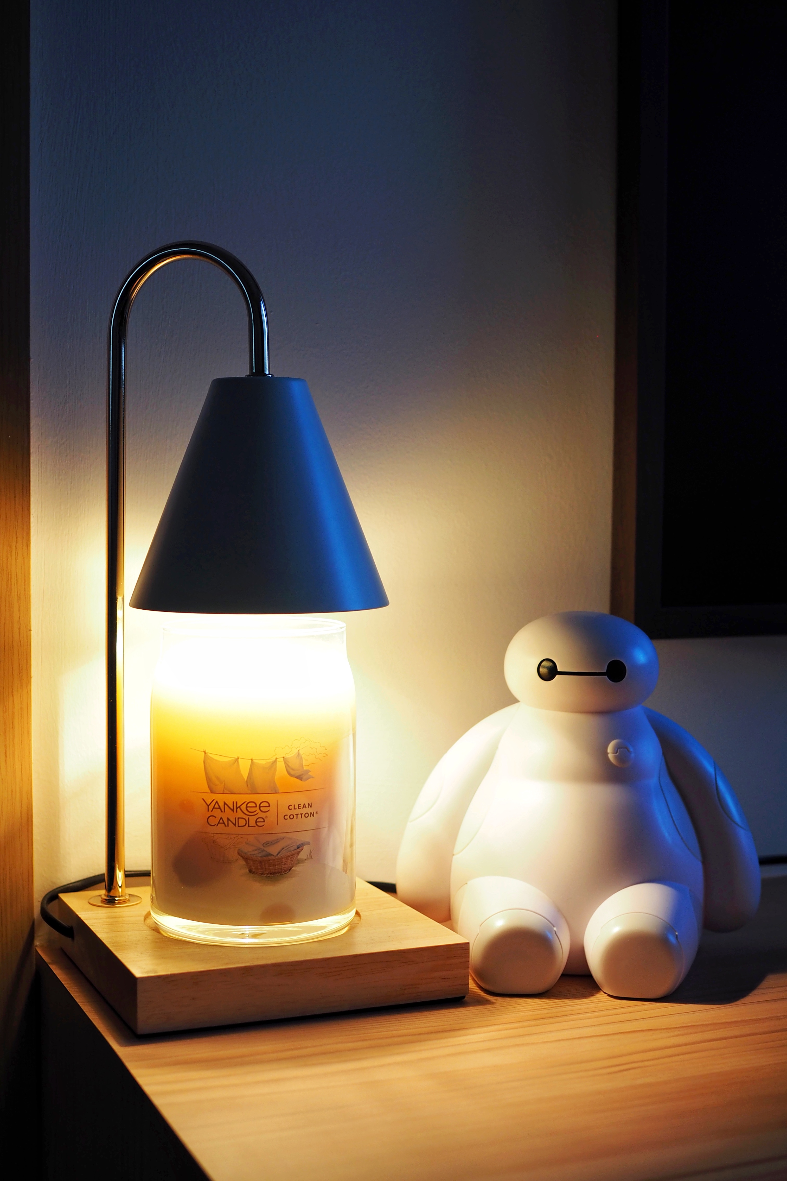 Our Cozy Corner - Yankee Candle, clean cotton, soft lighting, wooden shelf, modern decor, cozy ambiance, white robot