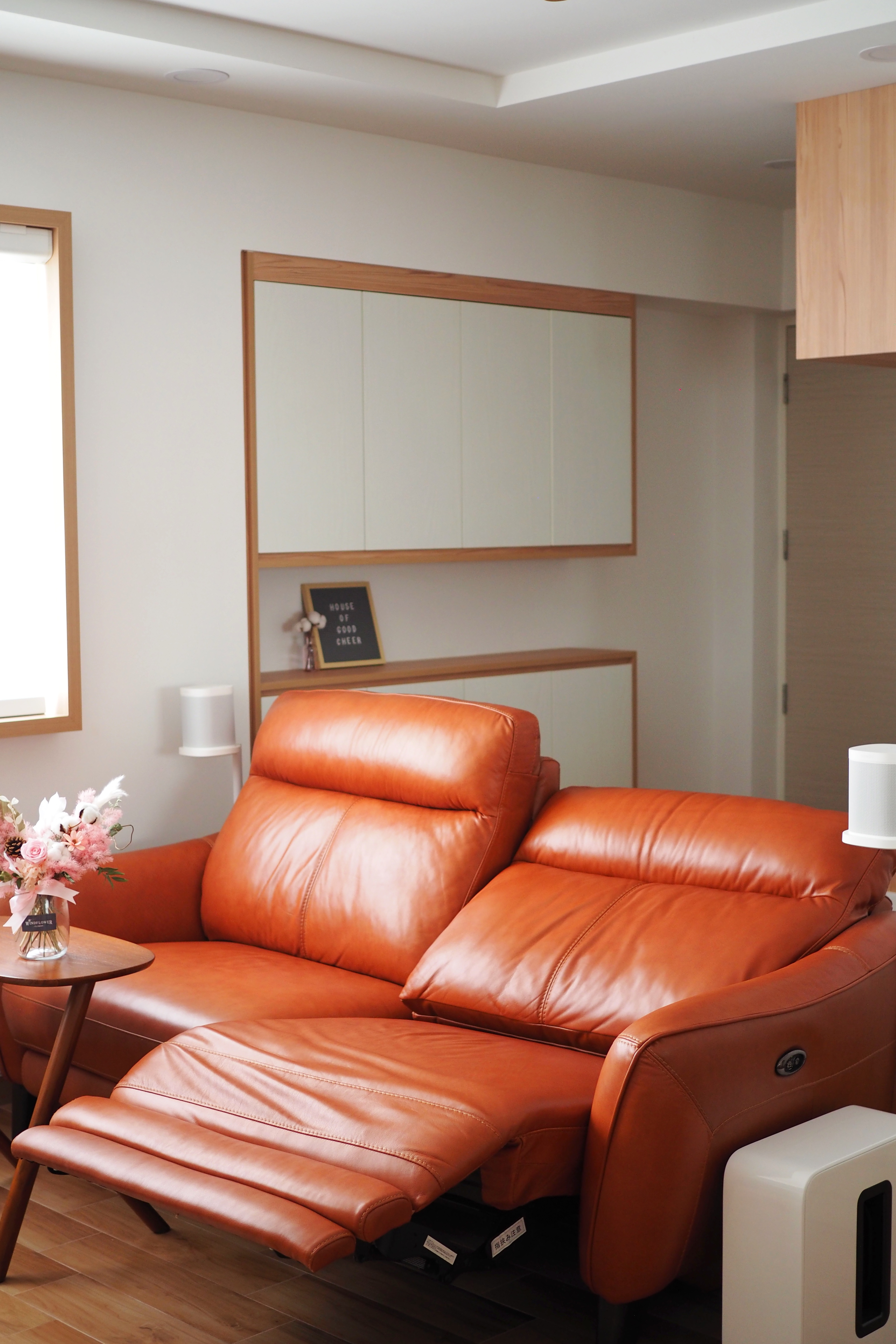 Our Cozy Corner - Lime green leather sofa, modern living room, cozy atmosphere, wooden accents, minimalist decor, white lamp