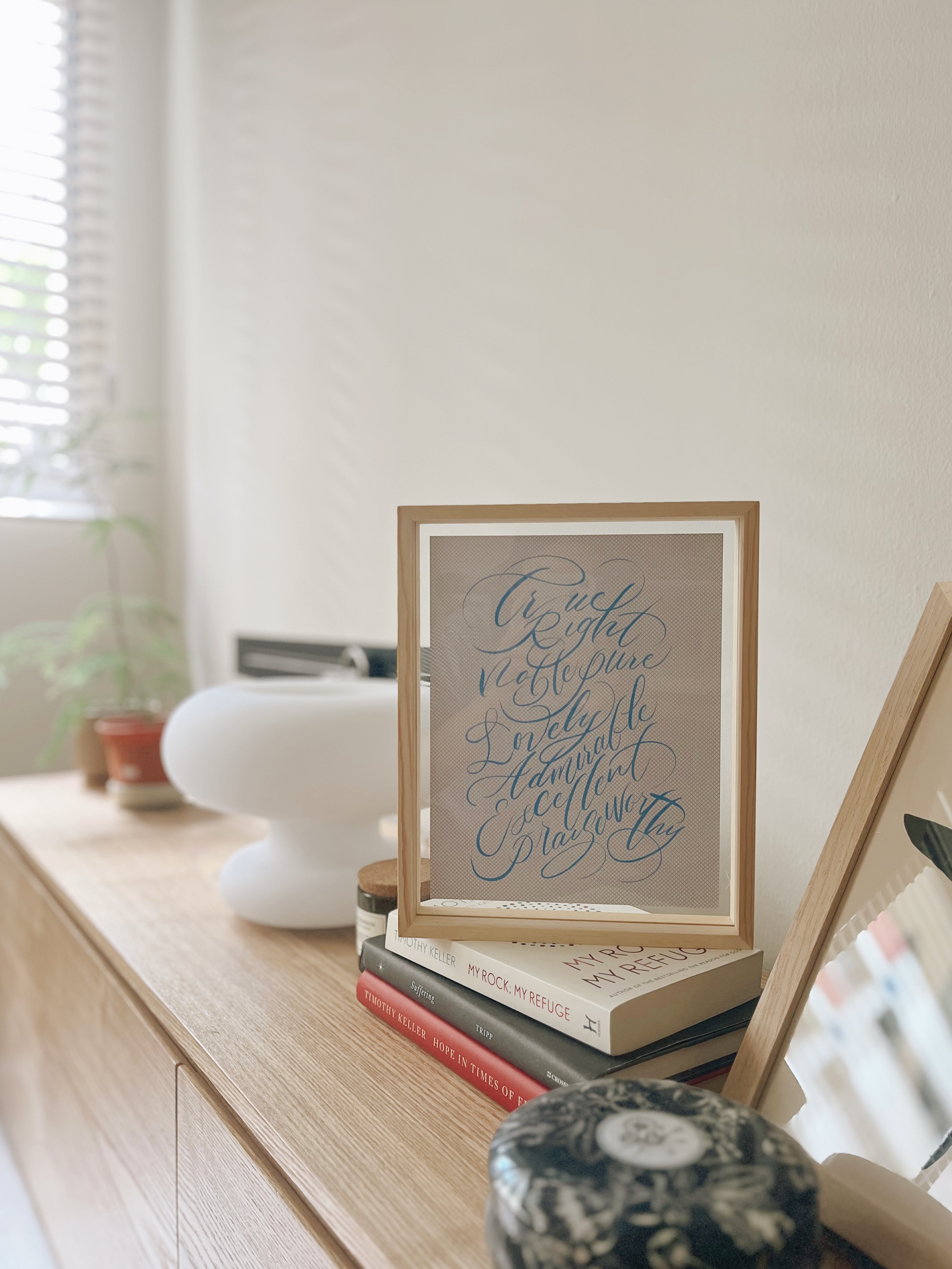 Cosiest nook for me-time and a book! - Cursive writing, framed artwork, natural light, wooden shelf, indoor plants, cozy