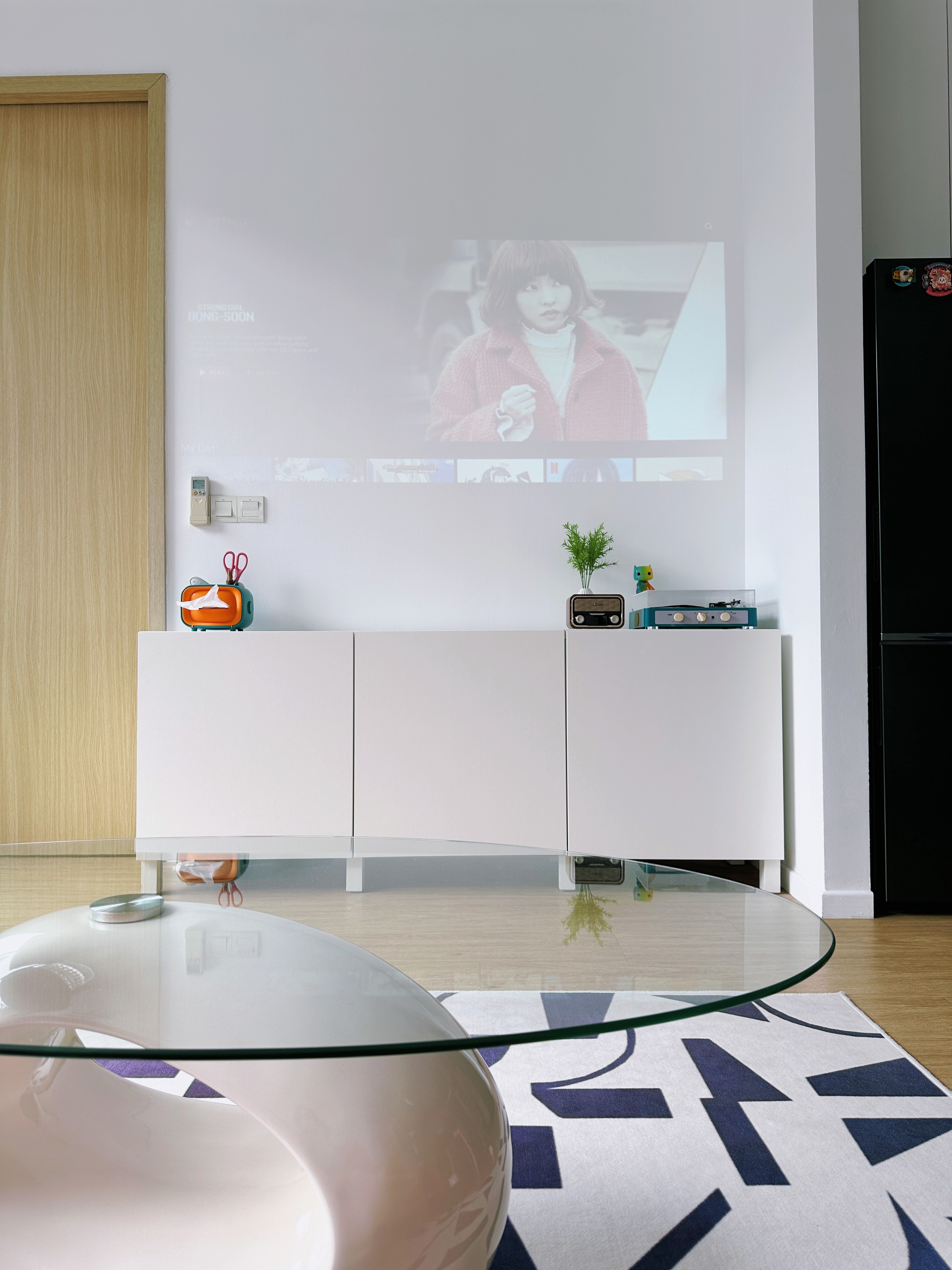 Cozy Home Theatre! (AKA Multi-Purpose Living Room) - Modern living room, minimalist decor, sleek furniture, large screen TV