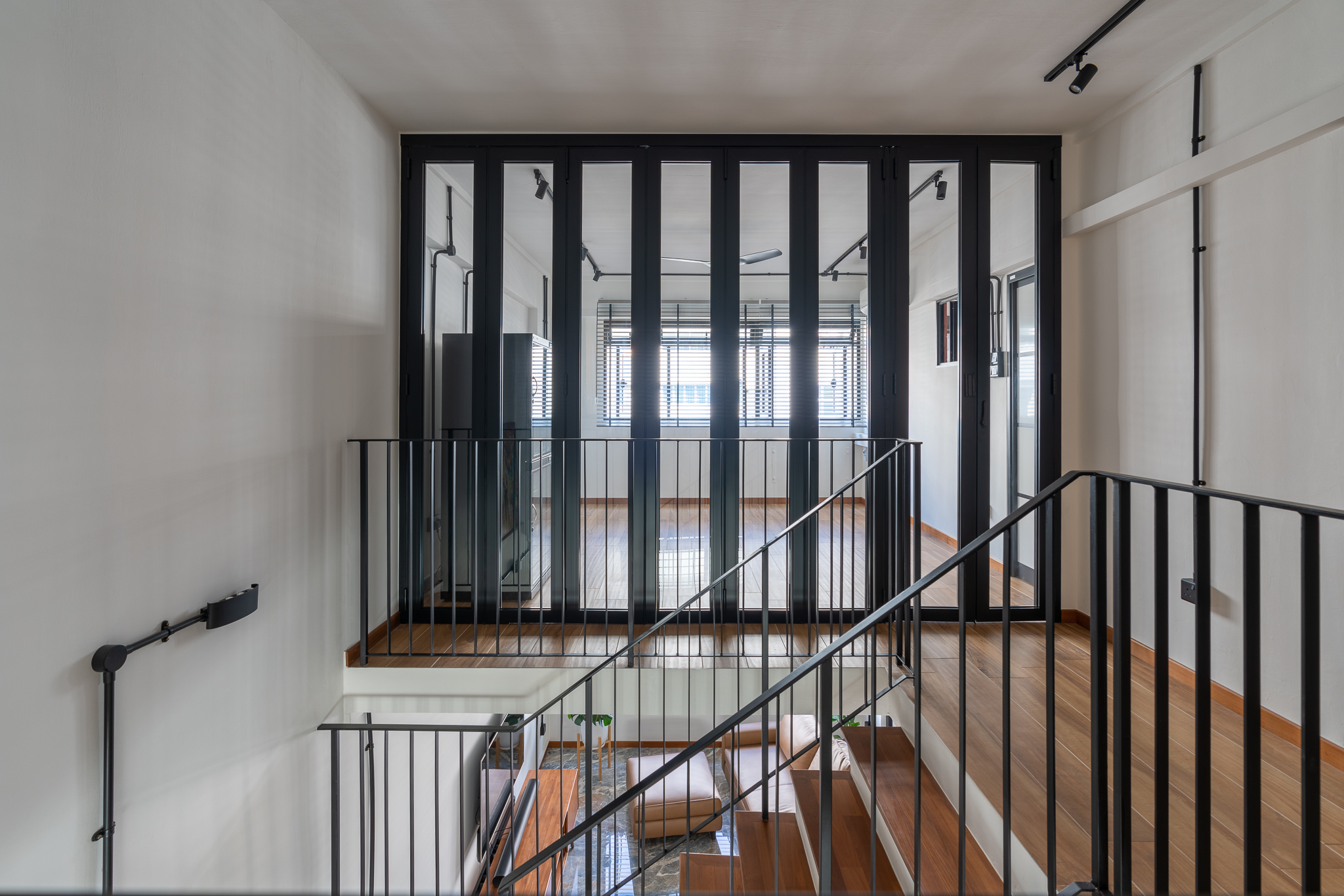 Breaking Walls and Perspectives - Modern minimalist interior, sleek black railings, spacious living room, large windows