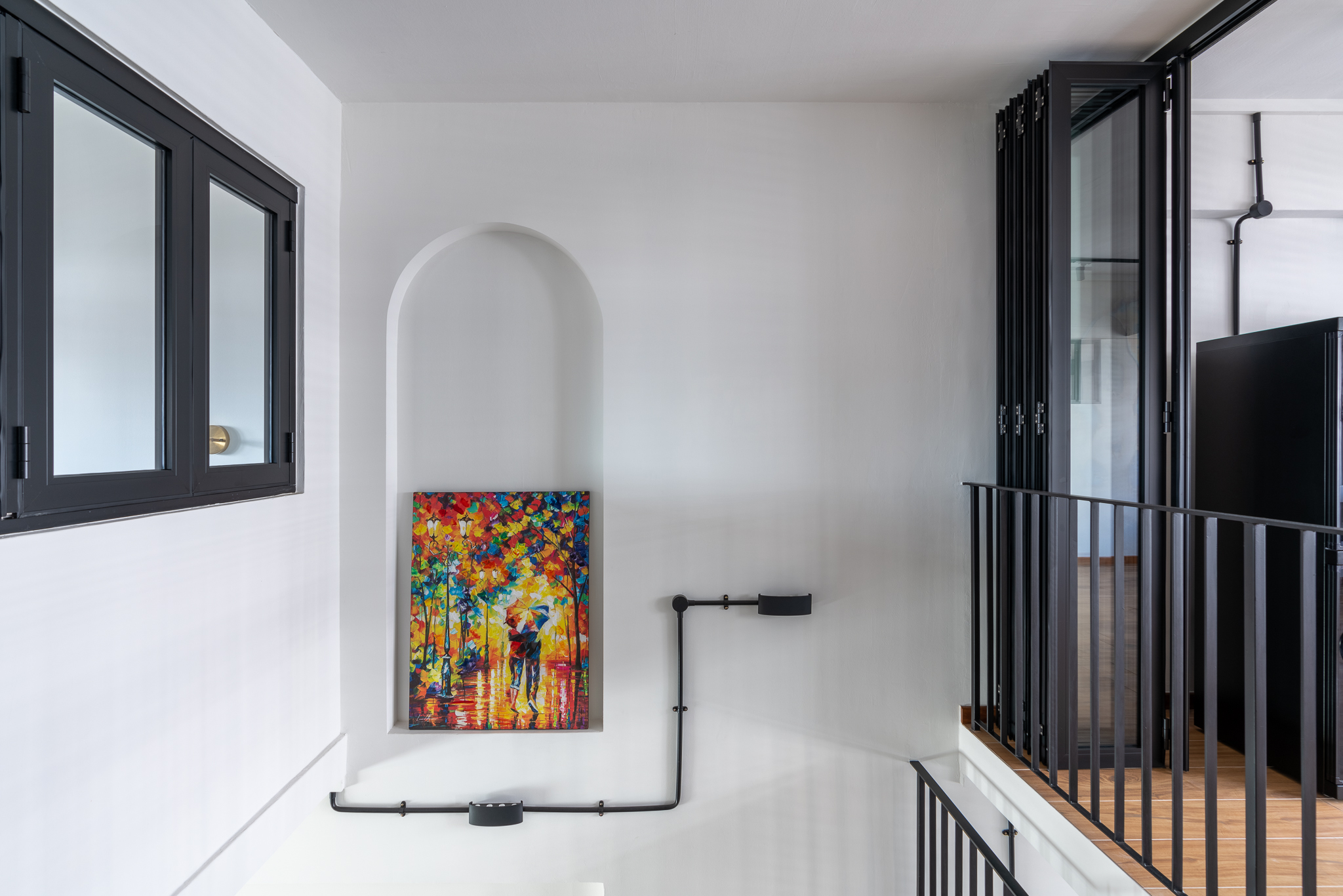 Breaking Walls and Perspectives - Modern minimalist interior, black metal railing, white walls, colorful abstract painting