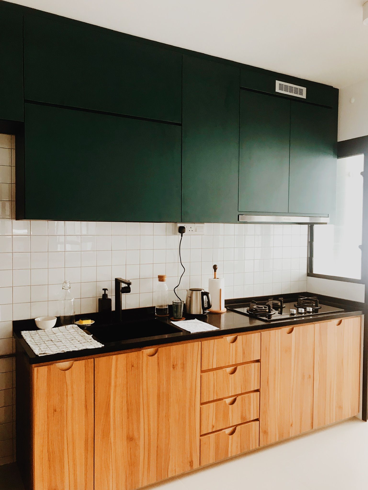 Revitalizing Our Kitchen: Tile Transformation & Custom Handles - Dark green kitchen cabinets, black countertop, white tiled
