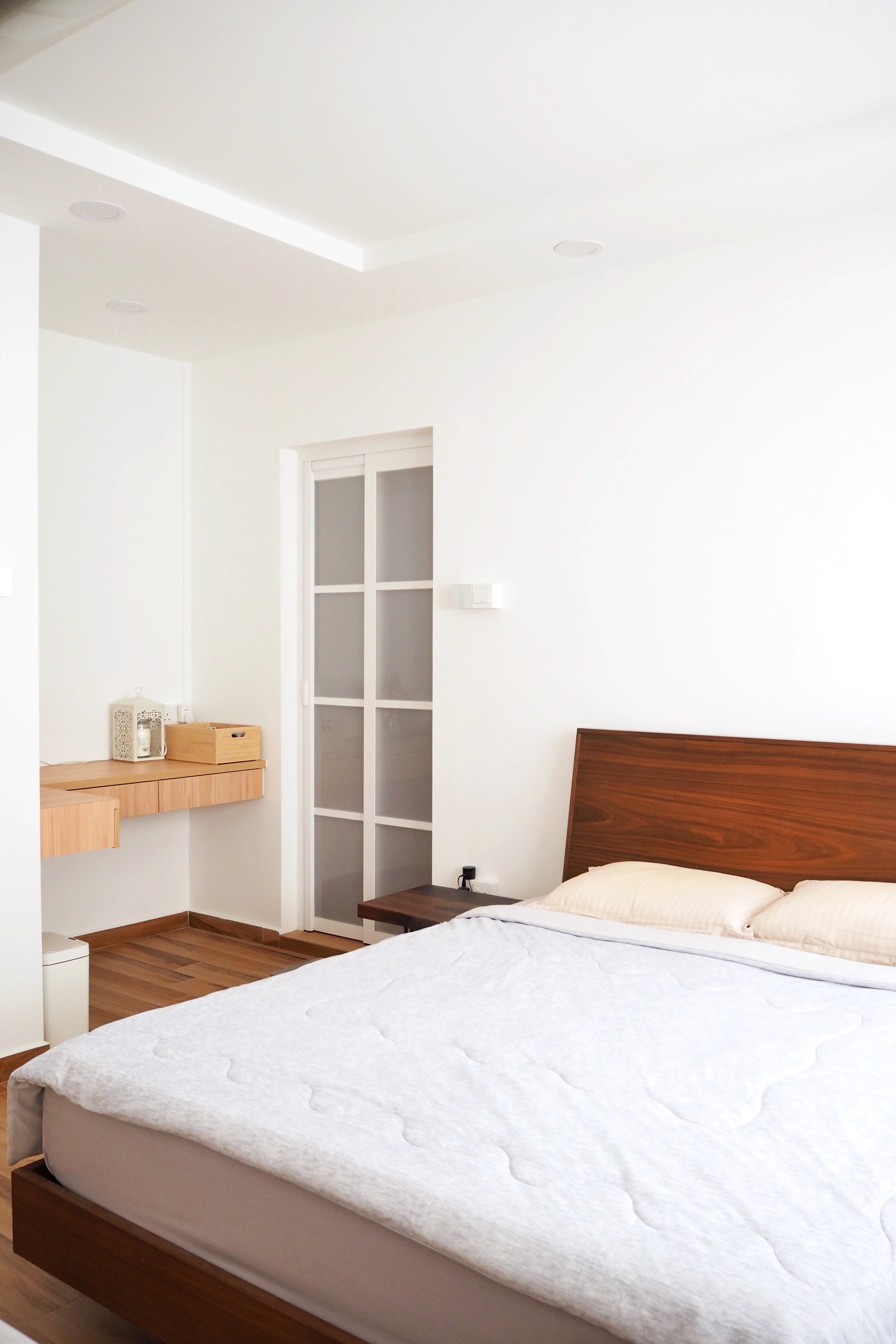 We Hacked Everything for This Bedroom Transformation - Modern minimalist bedroom, clean white walls, wooden desk, bedside