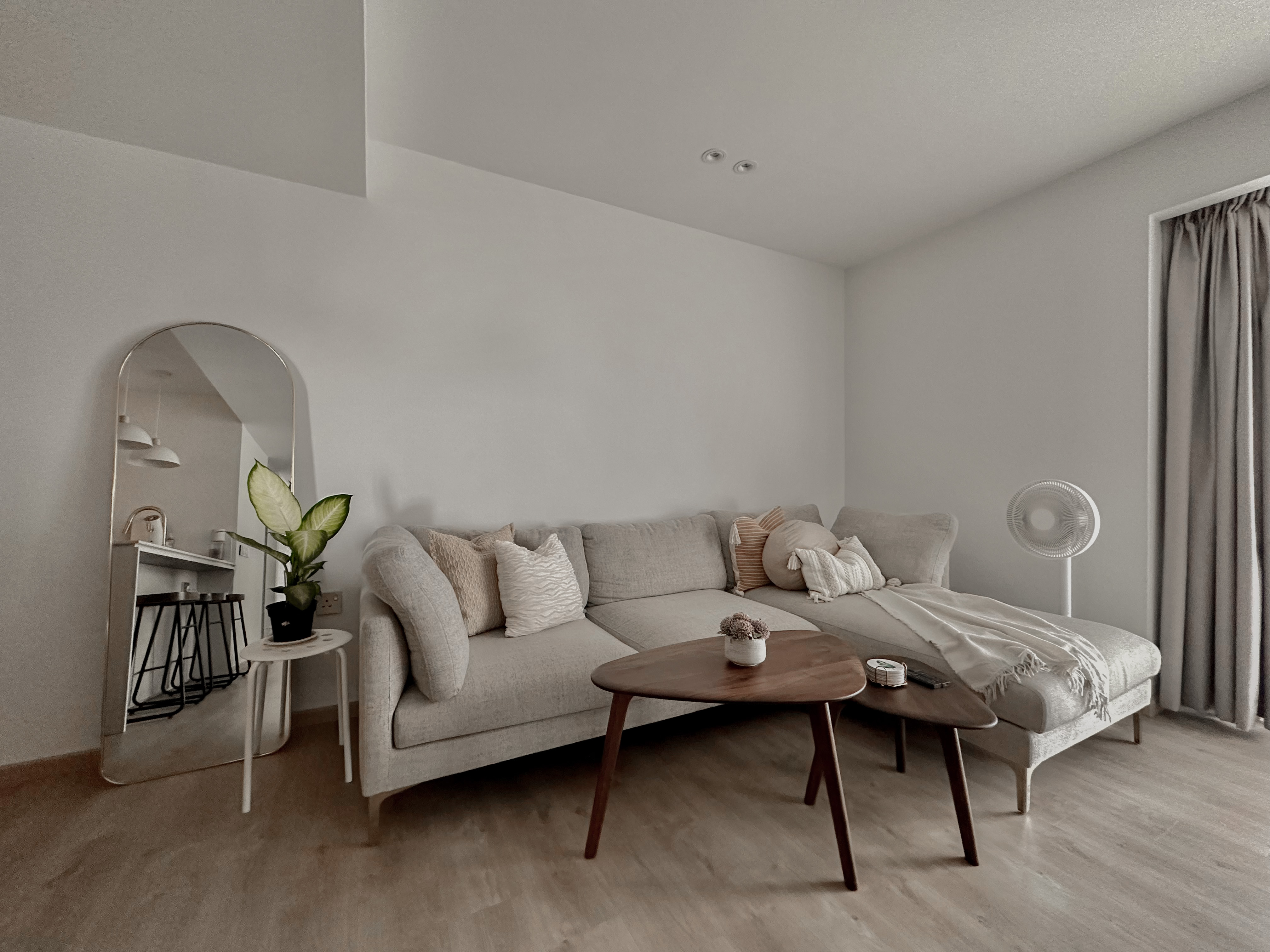 Cosy Living Room with Half TV Wall Storage - Modern minimalist living room, neutral color palette, cozy sofa, beige cushions