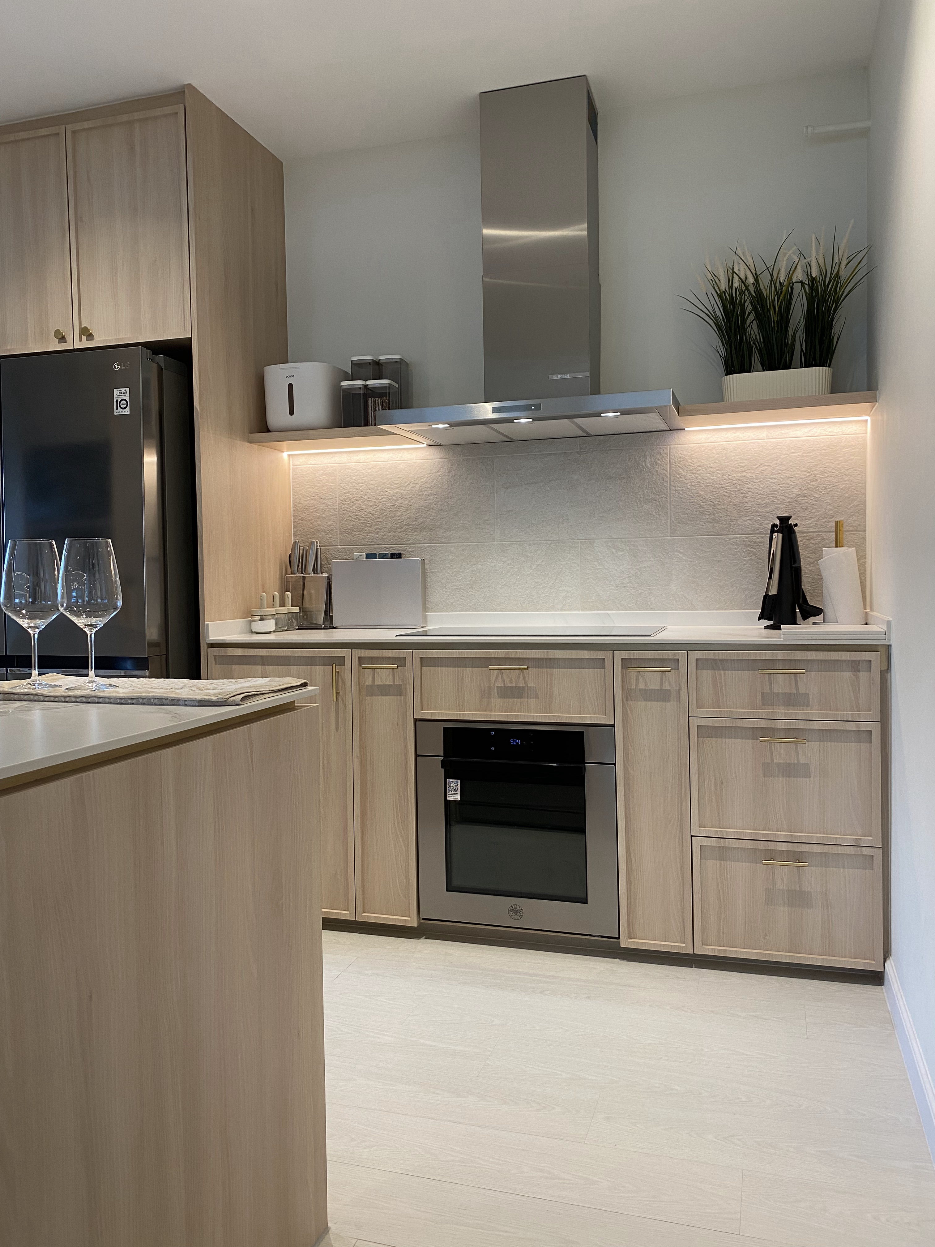 Parts of the house I really Love! - Modern kitchen with sleek design, light wood cabinets, stainless steel appliances