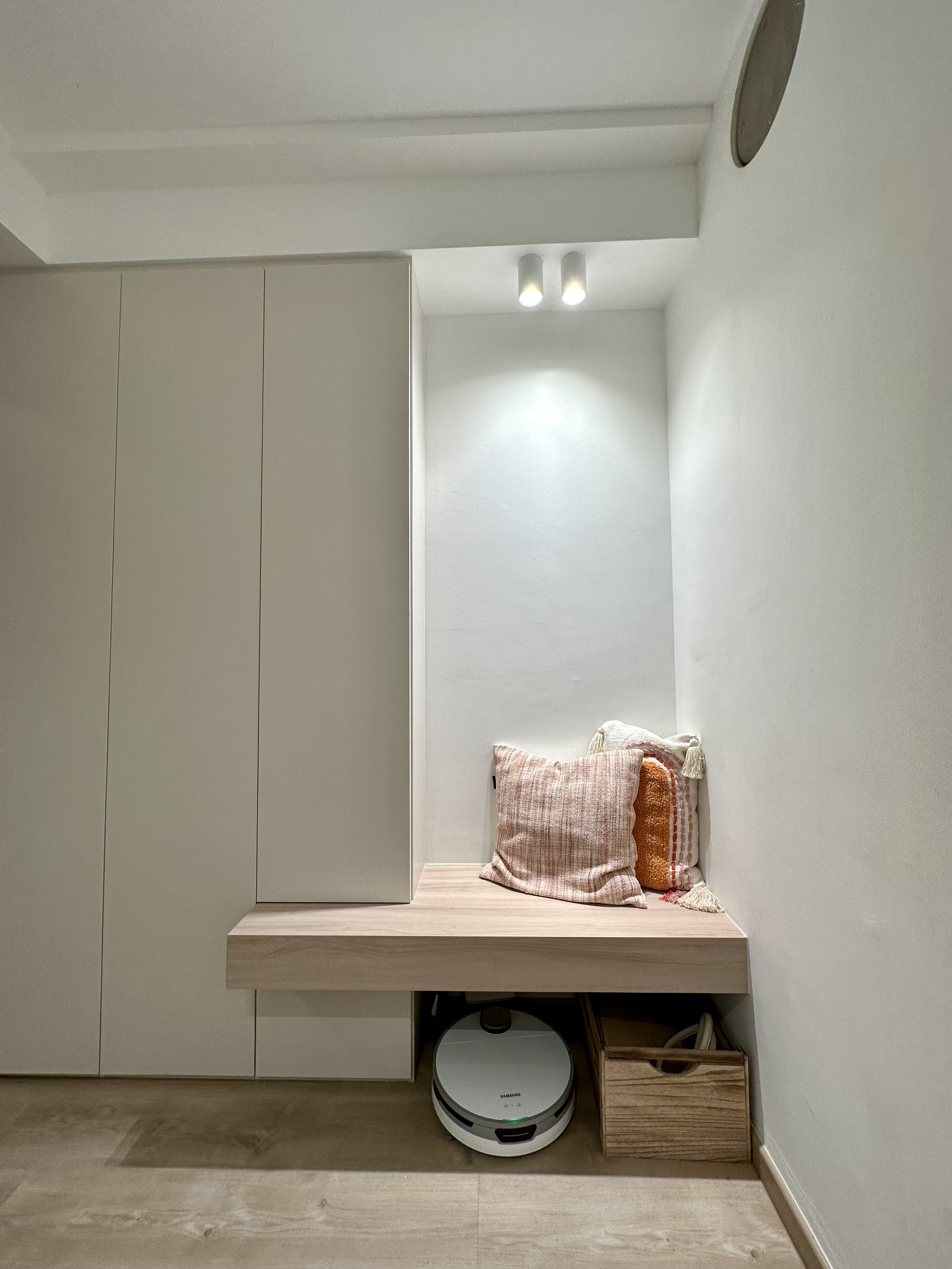 What We Do When We Don’t Exactly Have An Entryway - Wooden bench, minimalist design, modern decor, light-colored walls, sleek